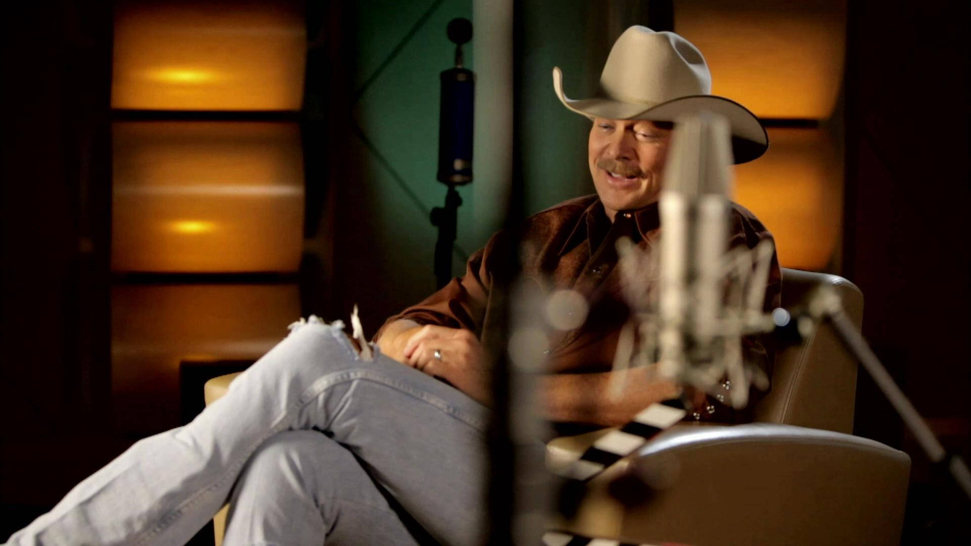 Alan Jackson On Brown Leather Chair