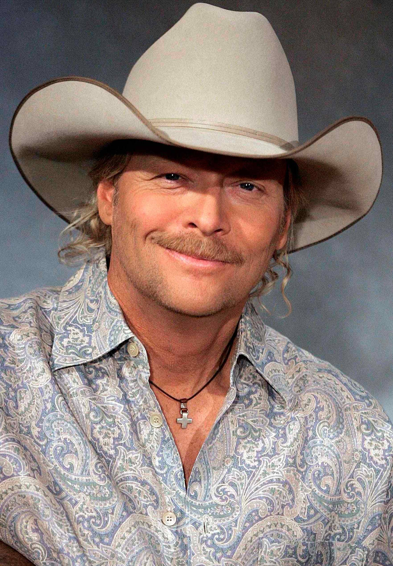 Alan Jackson Portrait Against Gray Limewash Background