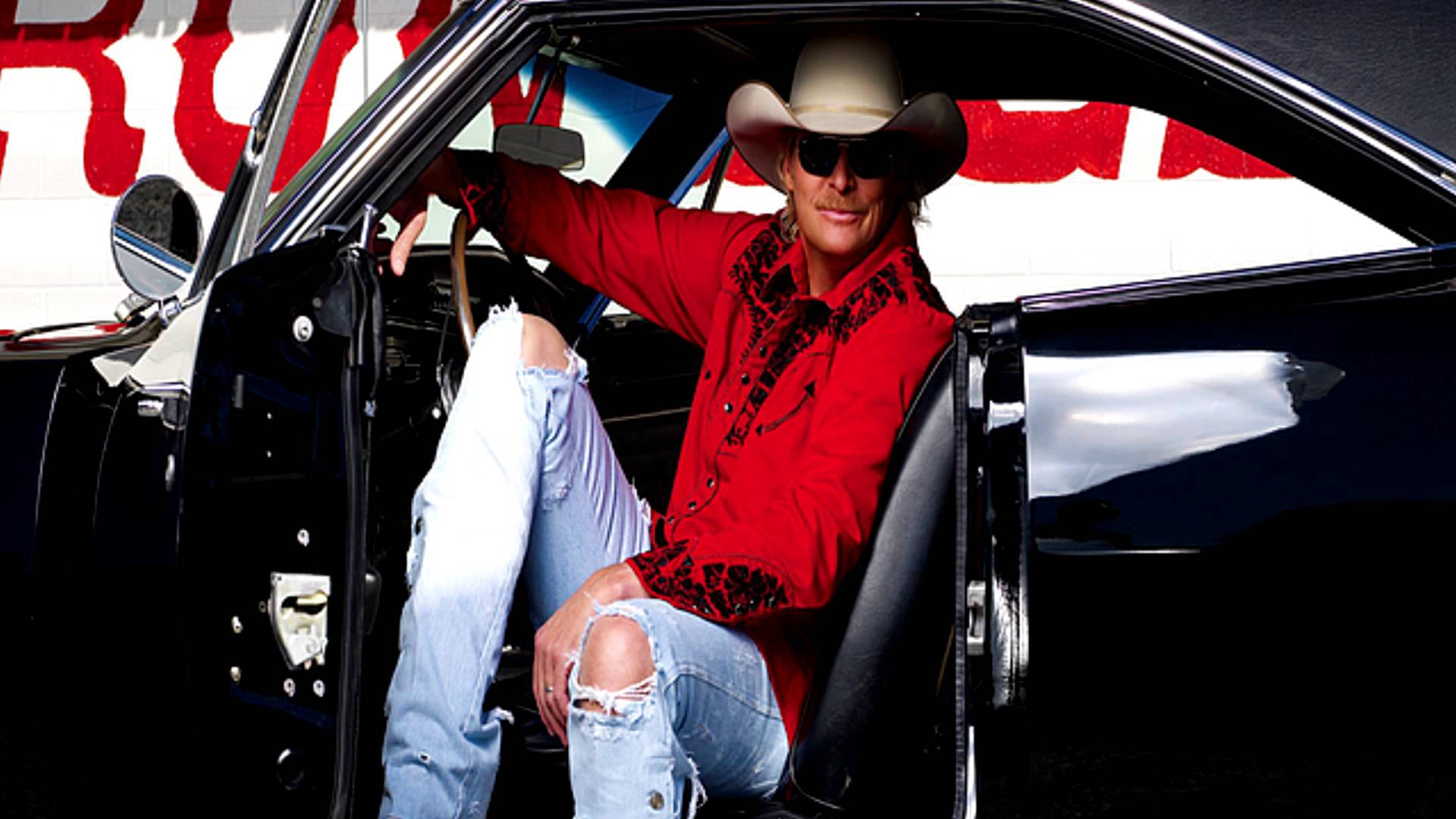 Alan Jackson Posing Inside Black Car Background