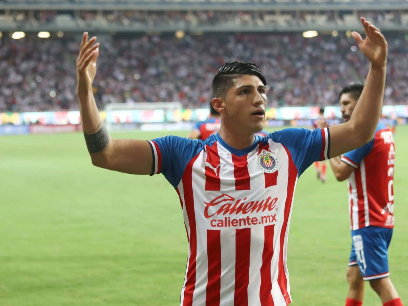 Alan Pulido Hyping Up The Crowd Background