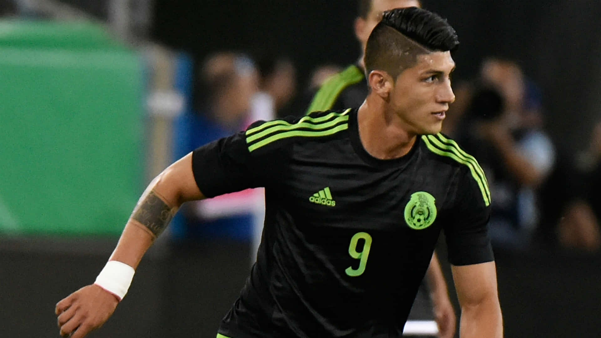 Alan Pulido In Black Adidas Jersey Background