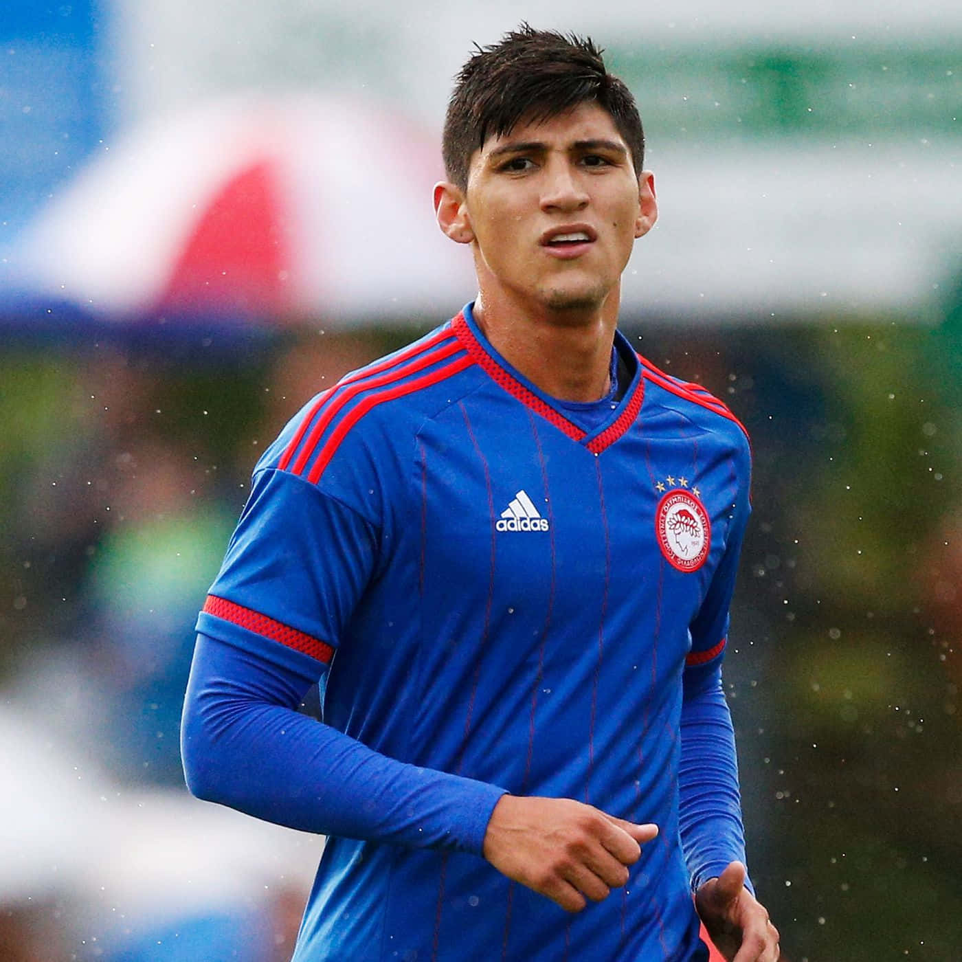 Alan Pulido In Blue Adidas Jersey Background