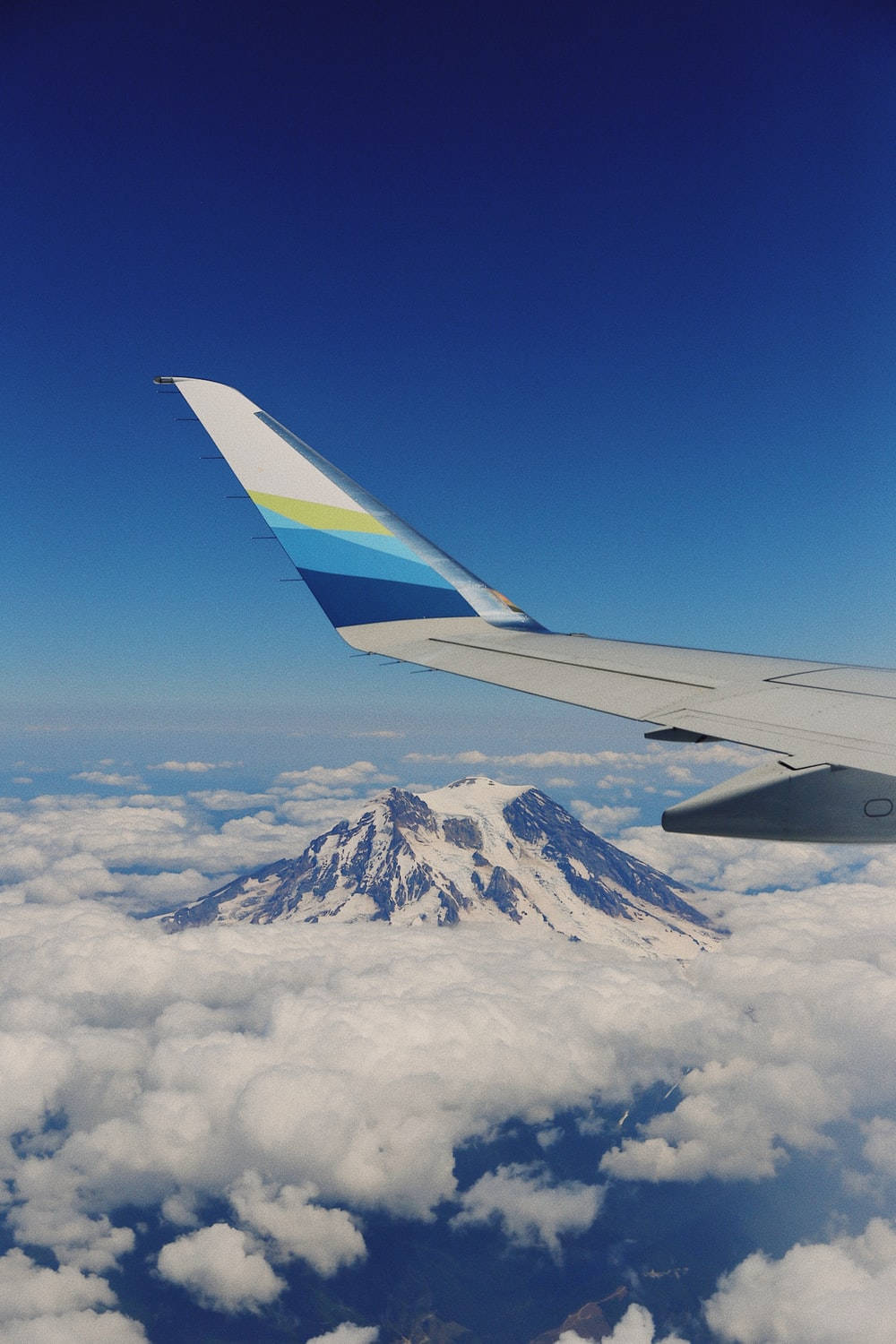 Alaska Airlines Above Tall Snowy Mountain Background