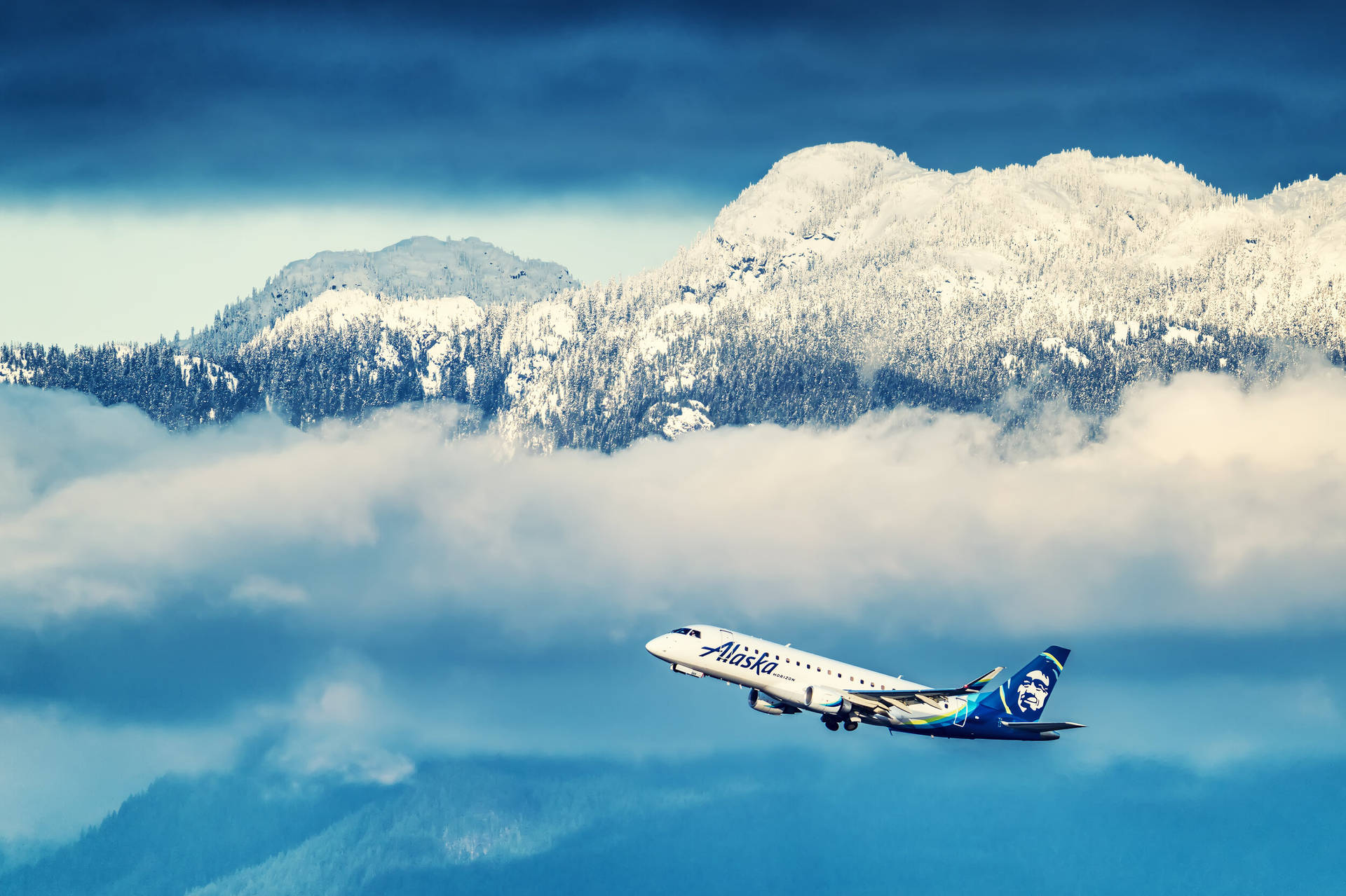 Alaska Airlines Passing Ragged Mountains