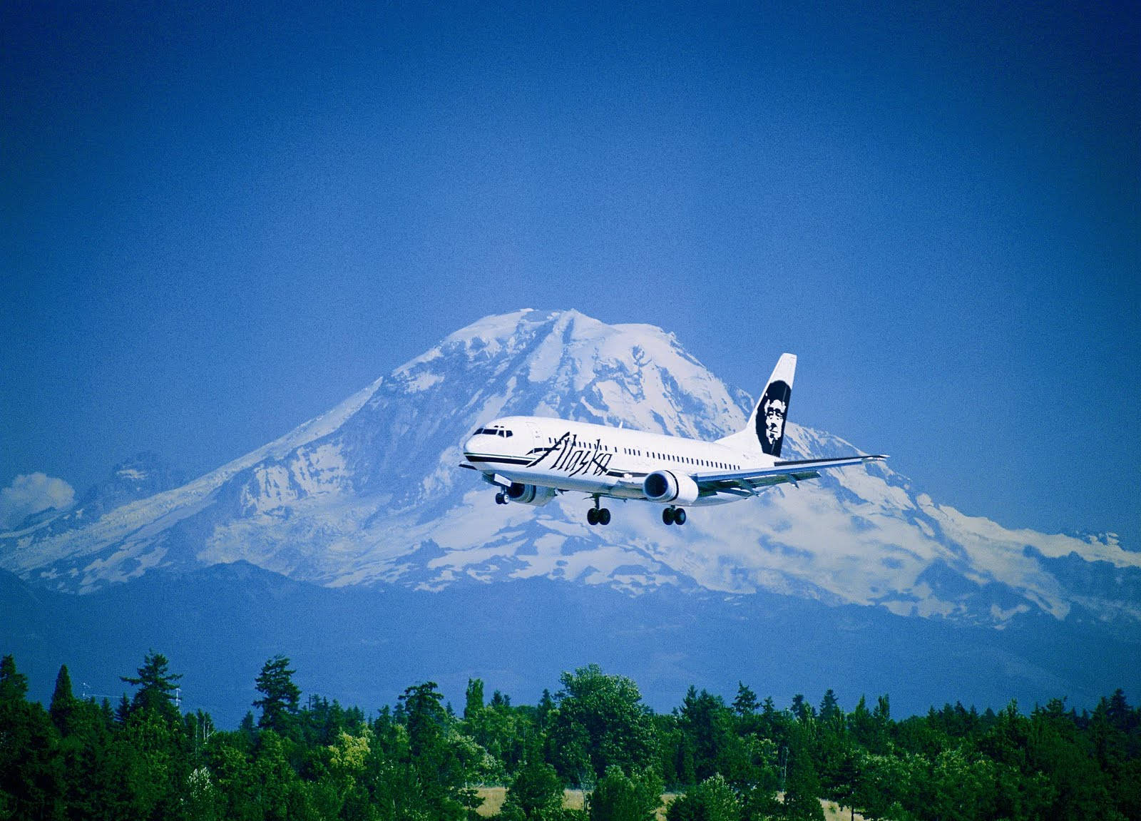 Alaska Airlines Plane By A Mountain Background