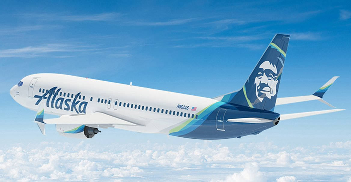 Alaska Airlines Plane In Bright Skies Background