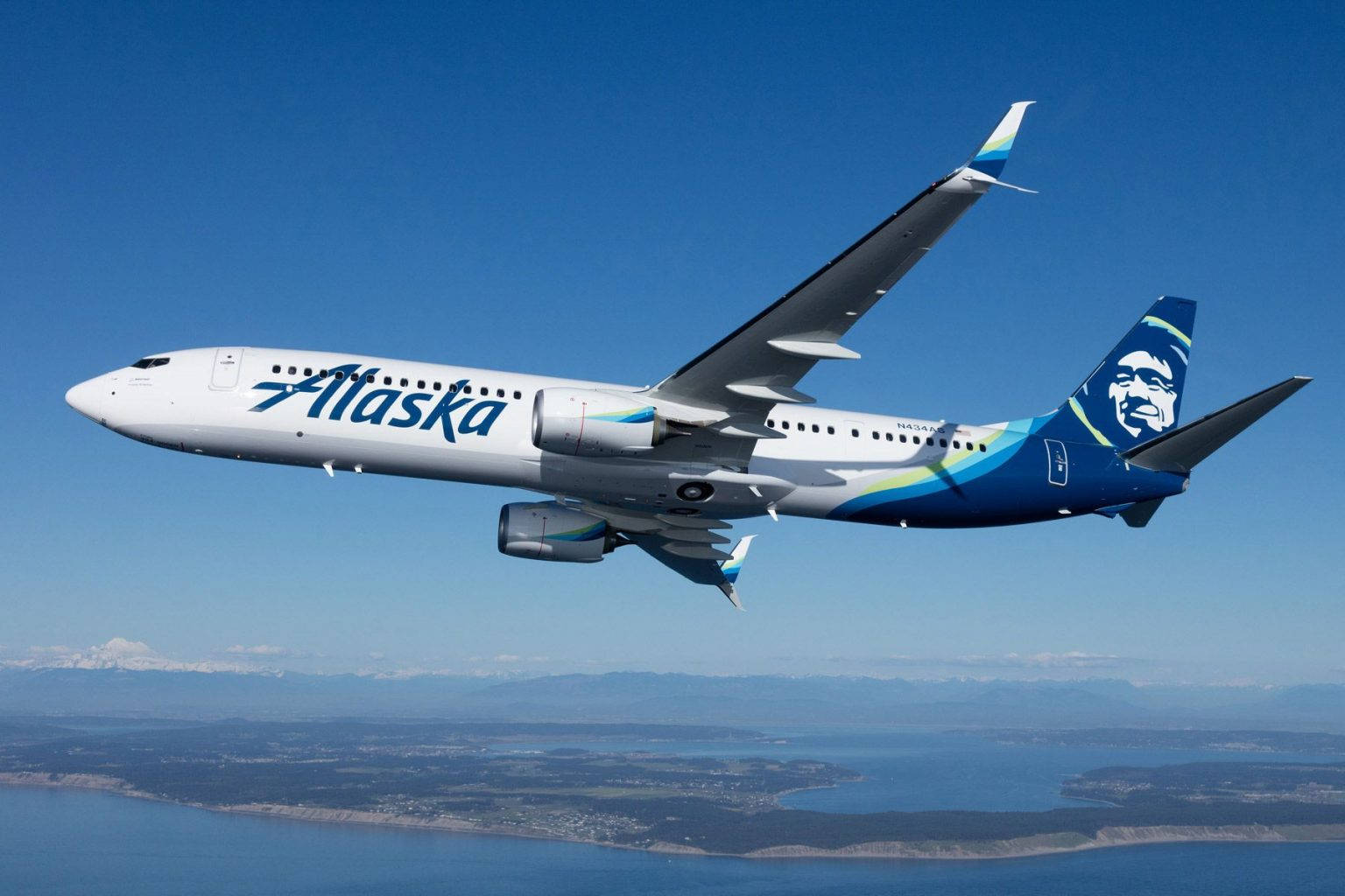 Alaska Airlines Soaring Above The Sea