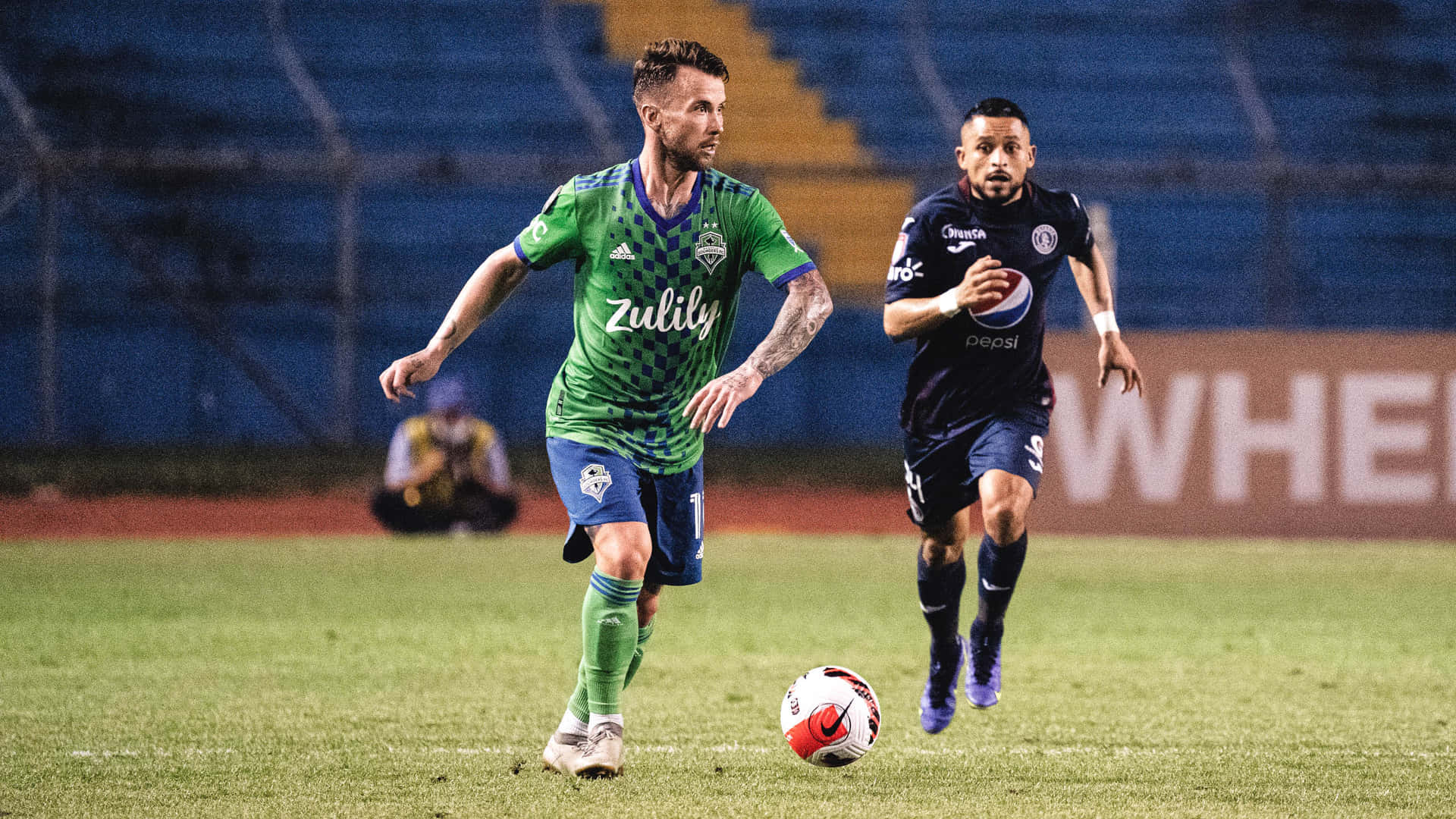 Albert Rusnak Seattle Sounders Chasing Ball Background