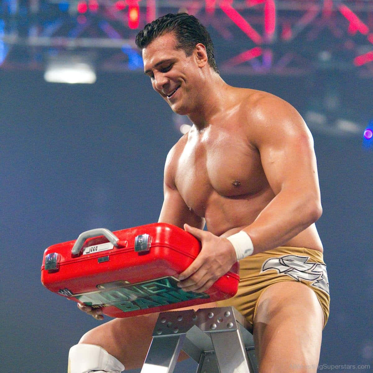 Alberto Del Rio Celebrating Victory With Money In The Bank Suitcase Background