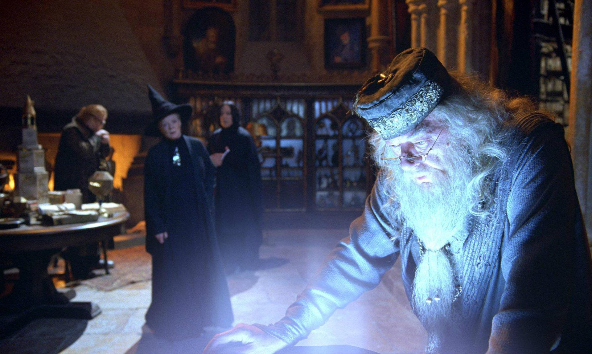 Albus Dumbledore Looks Into The Pensieve Background