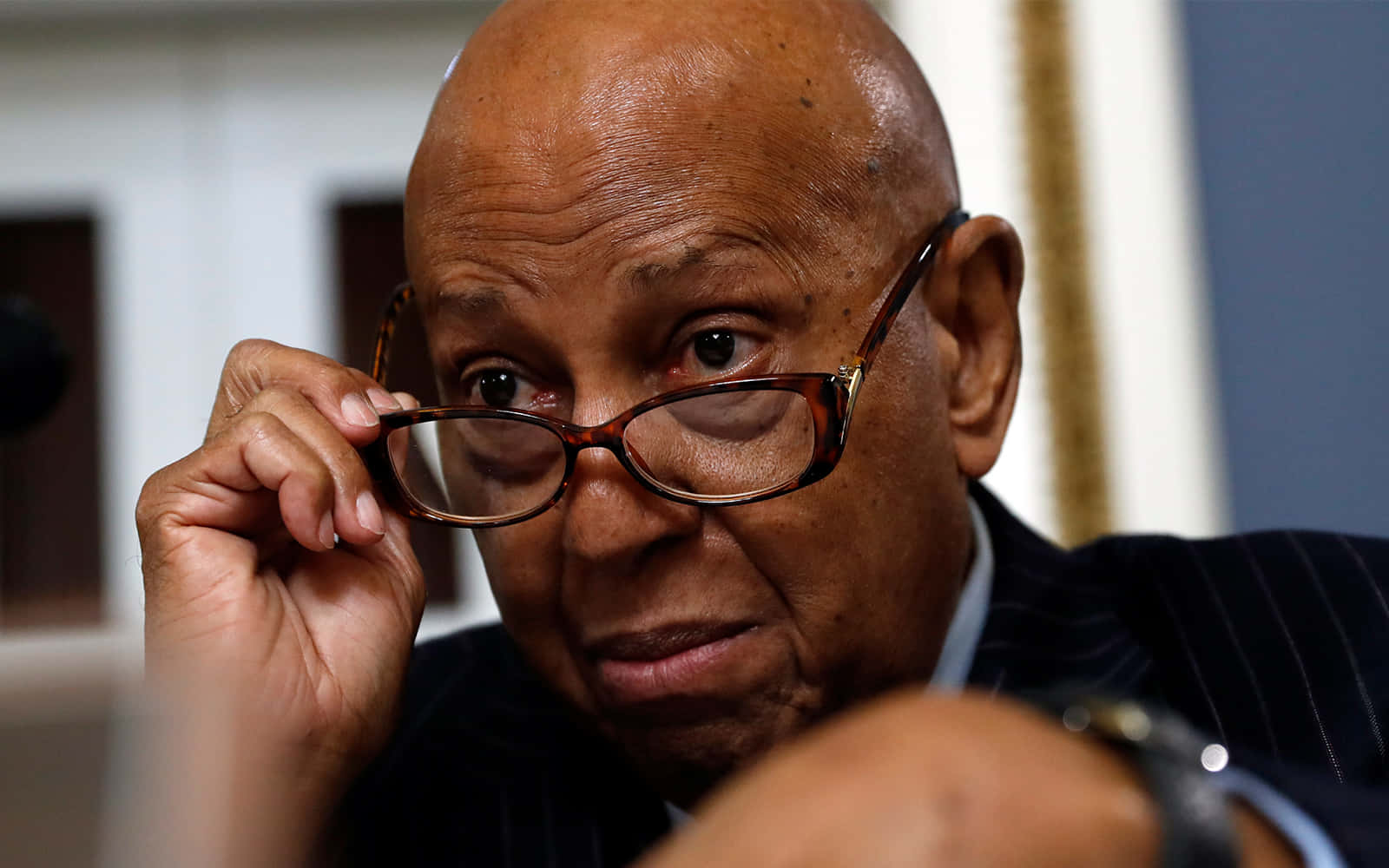 Alcee Hastings About To Remove Glasses Background