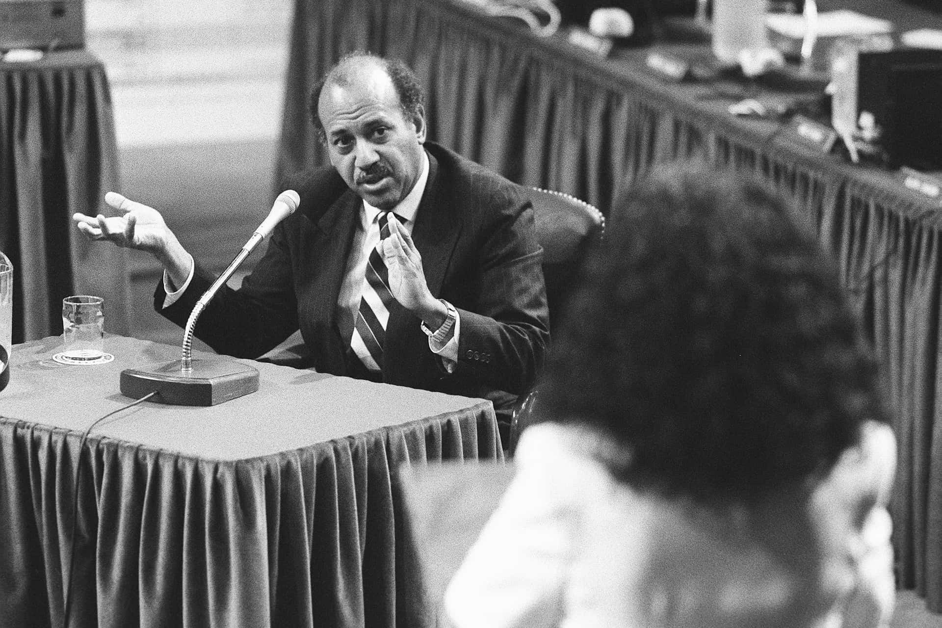 Alcee Hastings Deep In Discussion At A Meeting Background