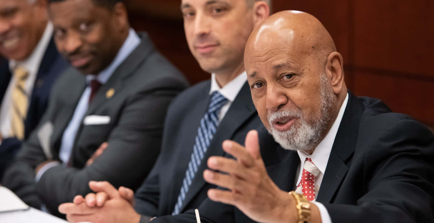 Alcee Hastings Speaking At A Public Forum Background