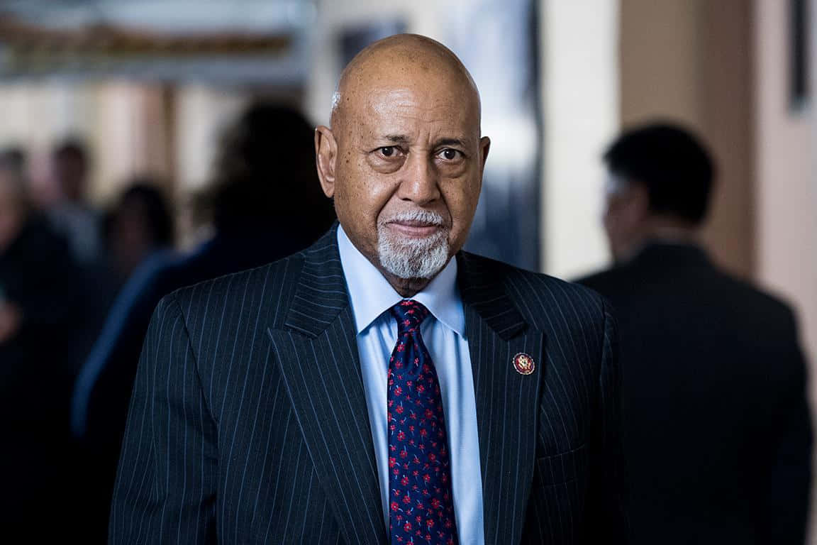 Alcee Hastings With A Somber Expression Background