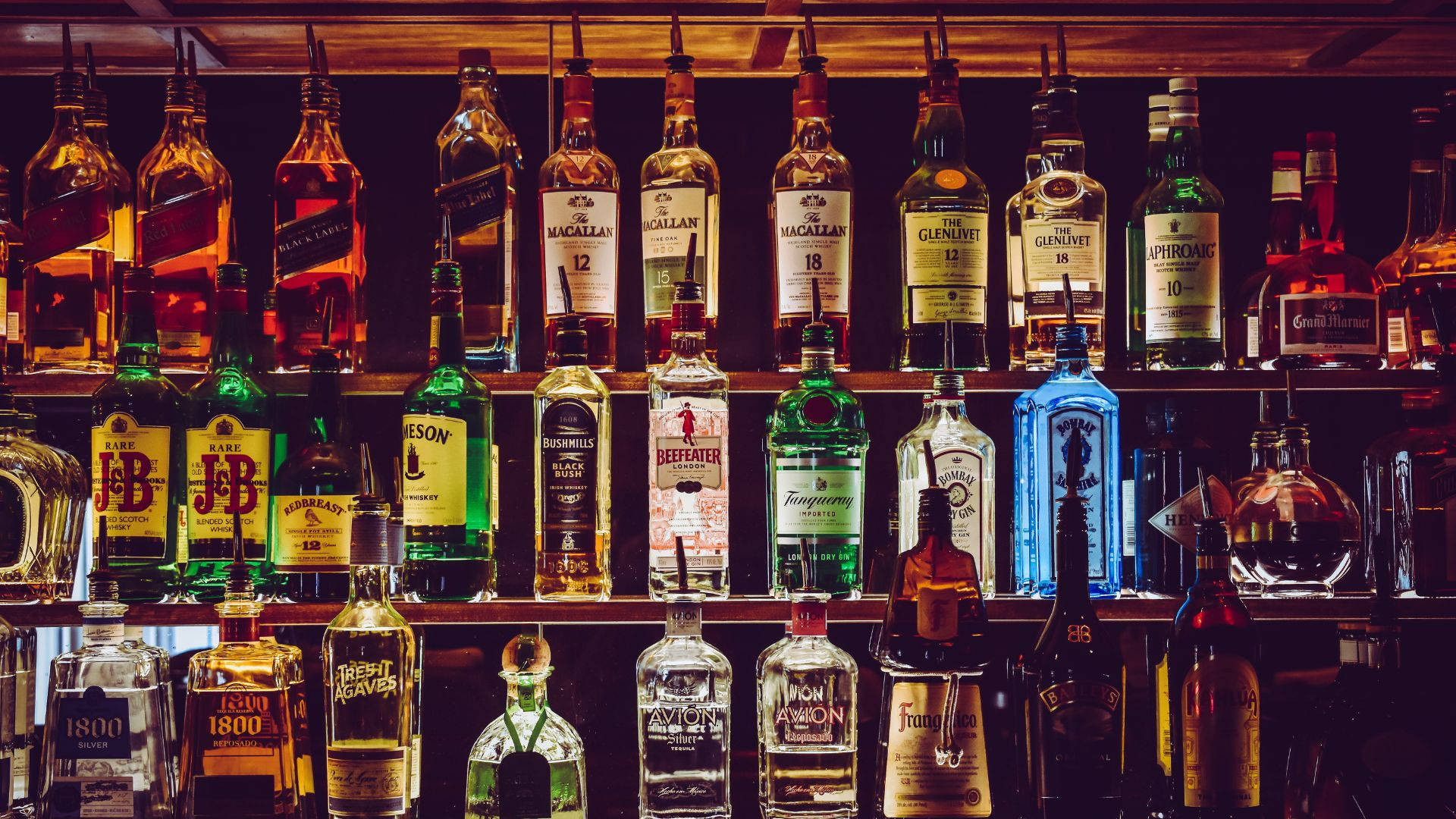 Alcohol Bottles On Liquor Store Background