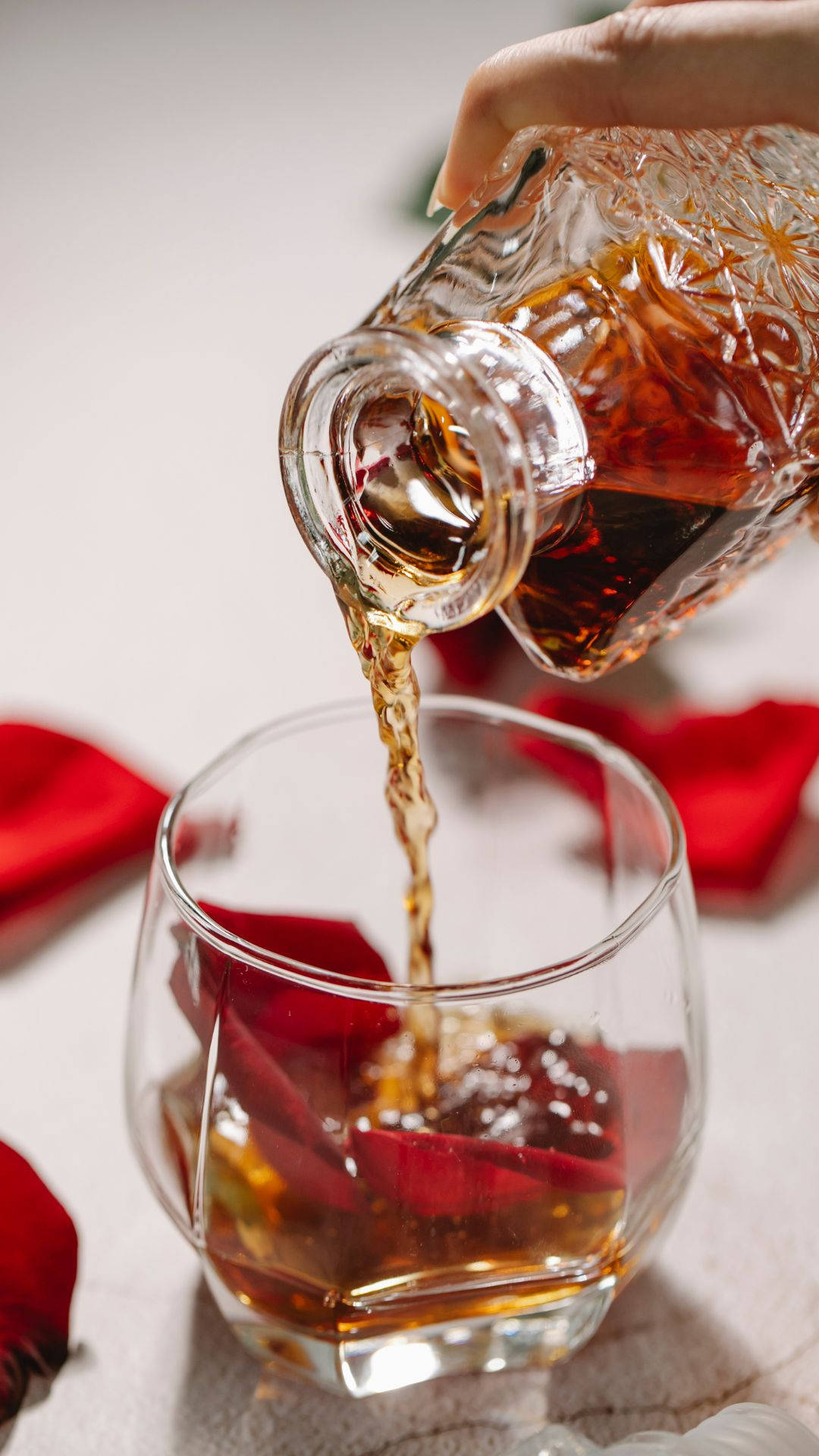 Alcohol Pouring Into Glass Background