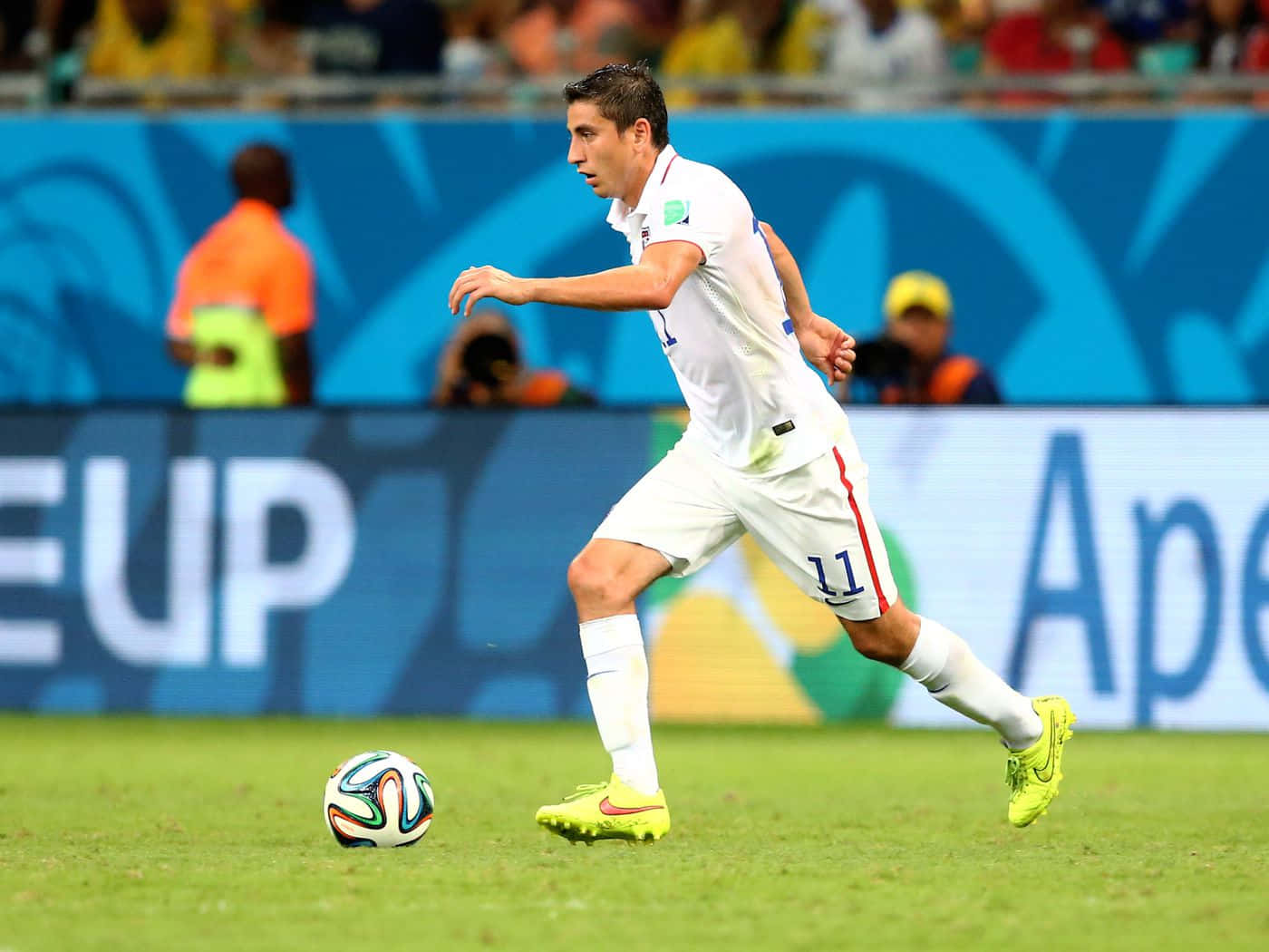 Alejandro Bedoya Kicking The Ball Background