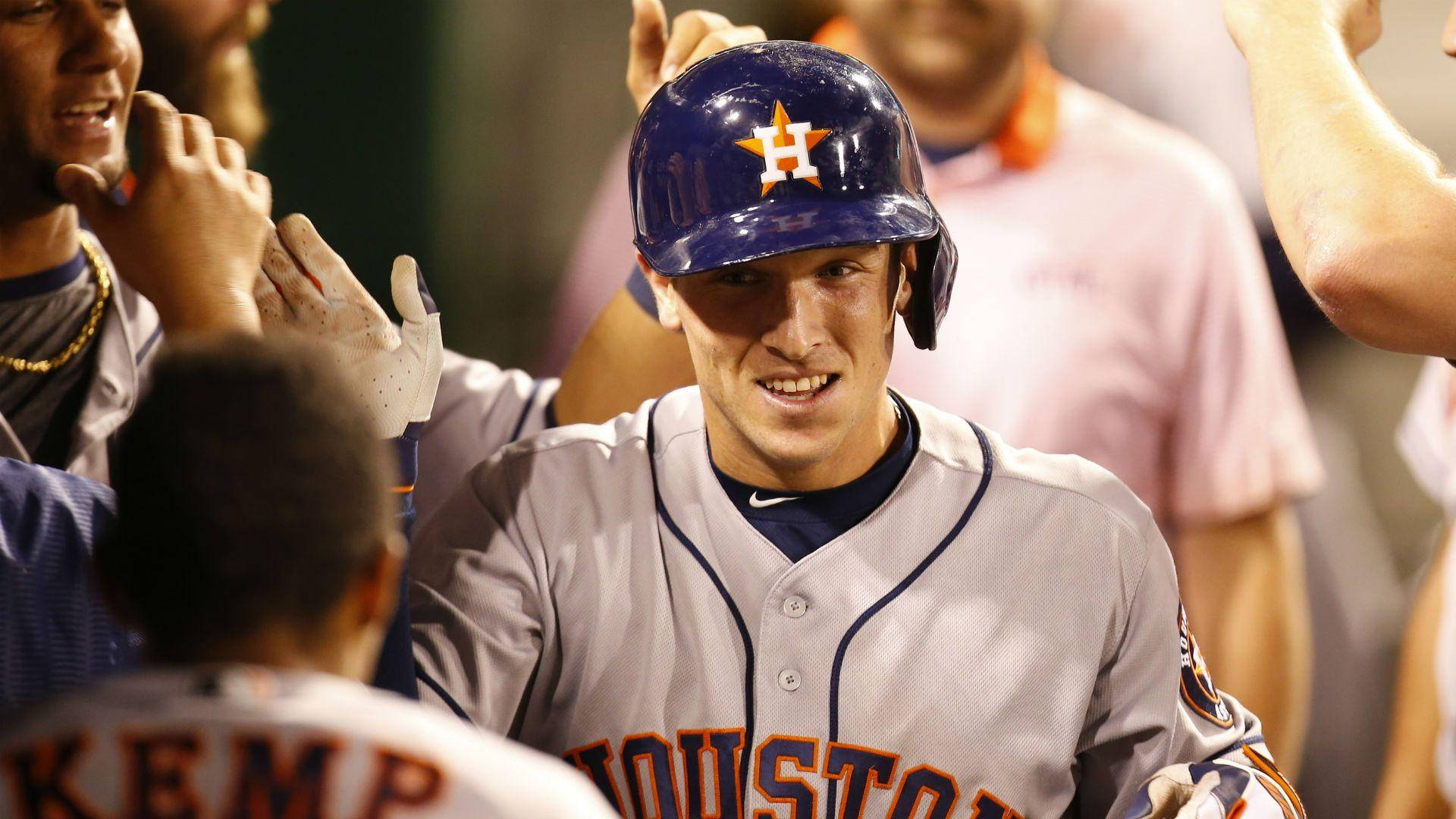 Alex Bregman Surrounded By Teammates Background