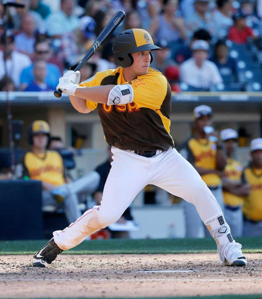Alex Bregman Swinging Bat In Yellow And Black Uniform Background