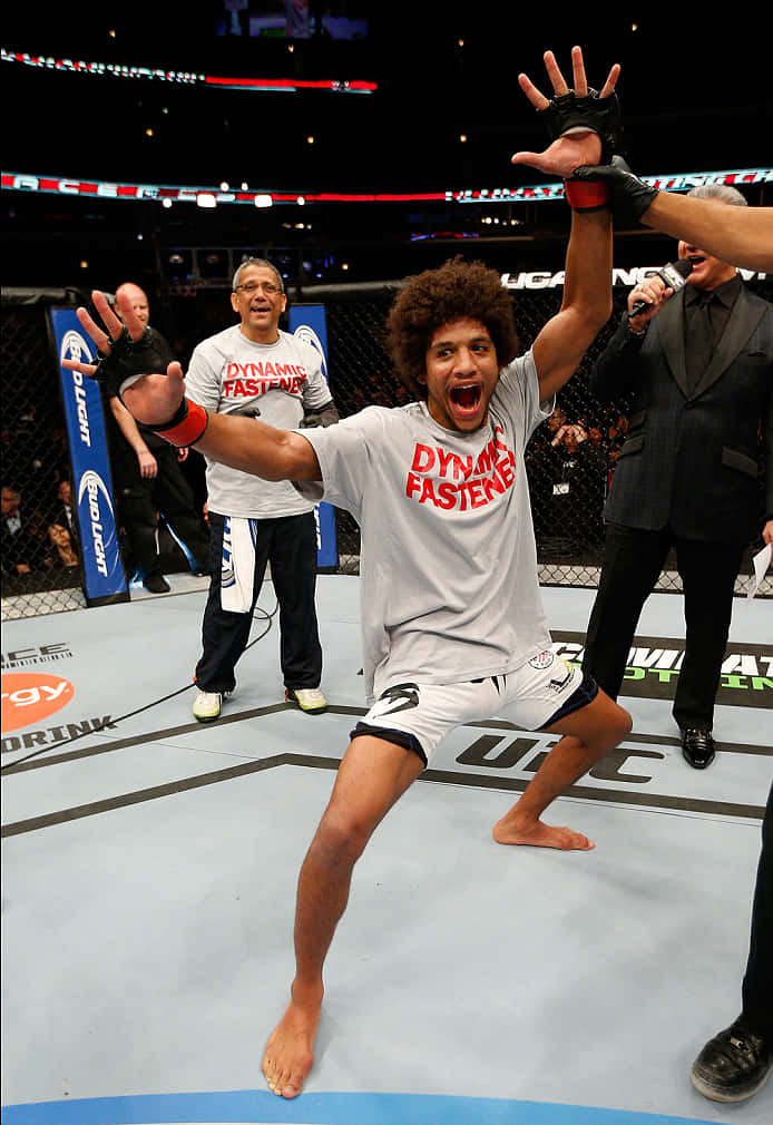 Alex Caceres Happy Cheering Inside Ring Background