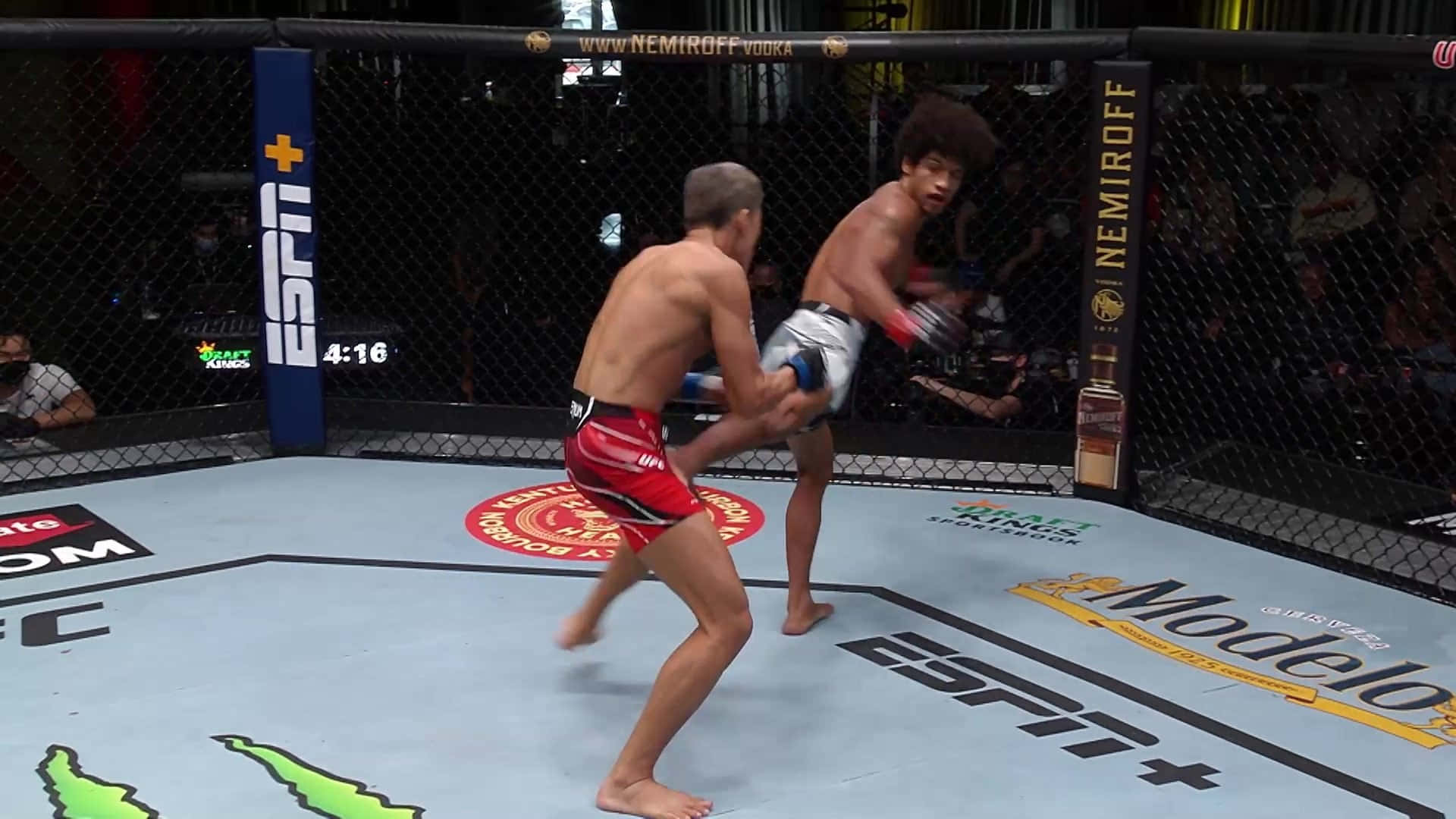 Alex Caceres Kicking Opponent Background