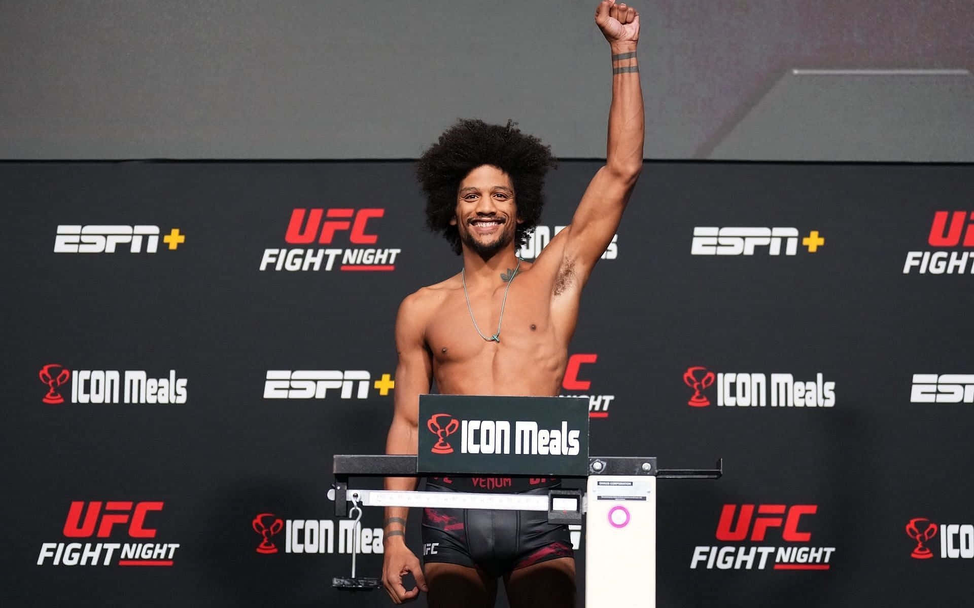 Alex Caceres Smiling At Weigh In Background