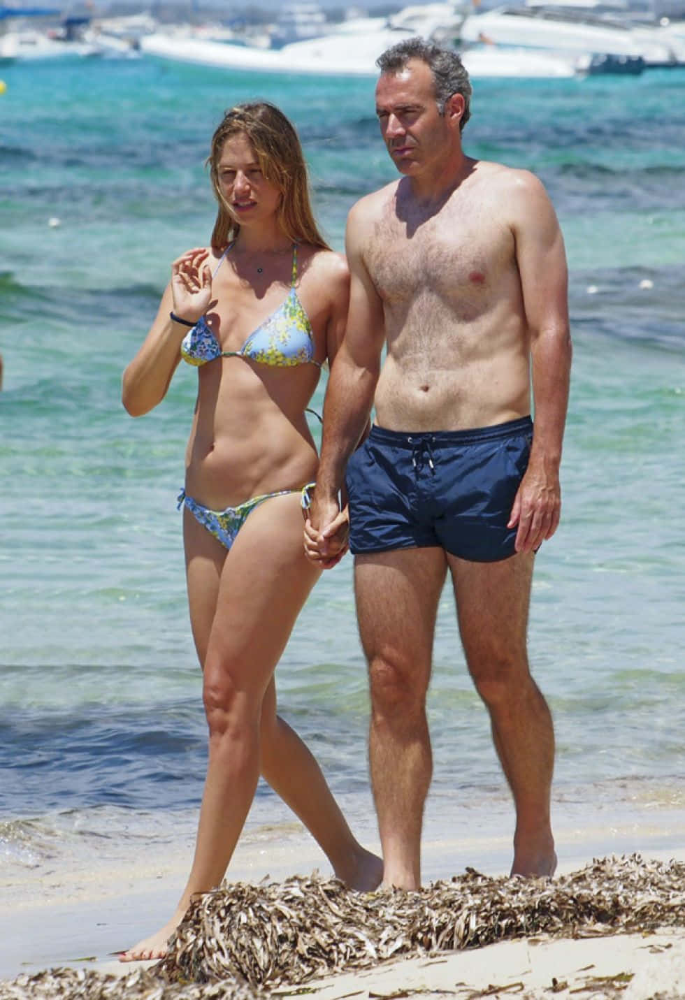 Alex Corretja And Wife Walking On Beach