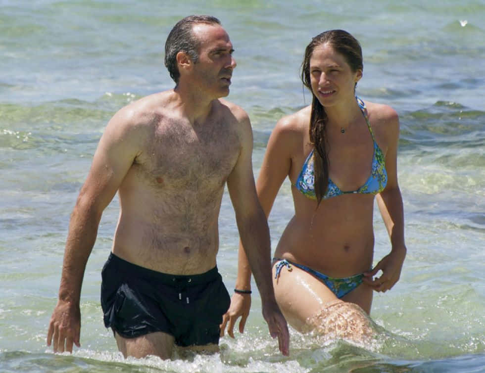 Alex Corretja Wading In Beach With Wife