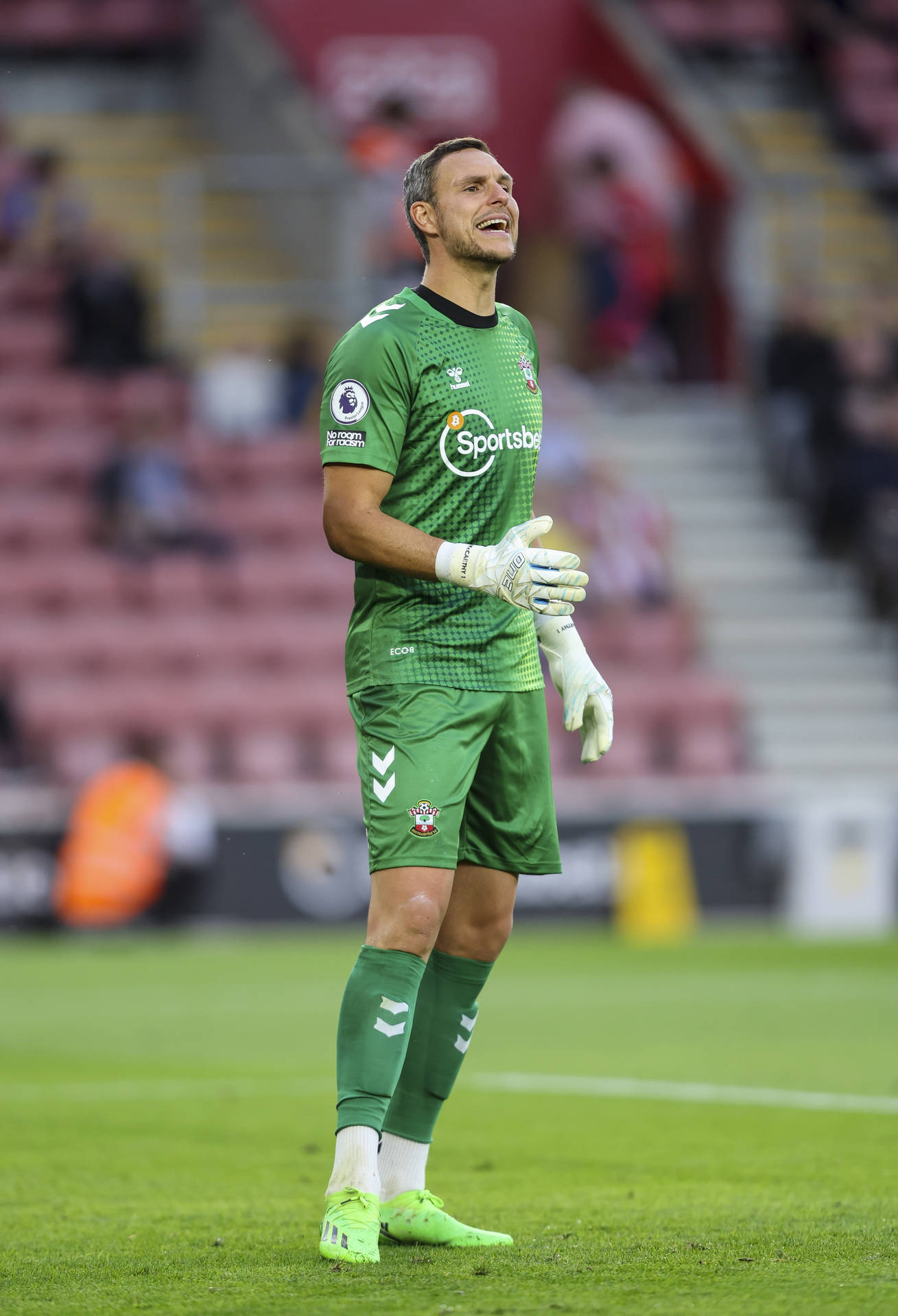 Alex Mccarthy At A Football Stadium Background