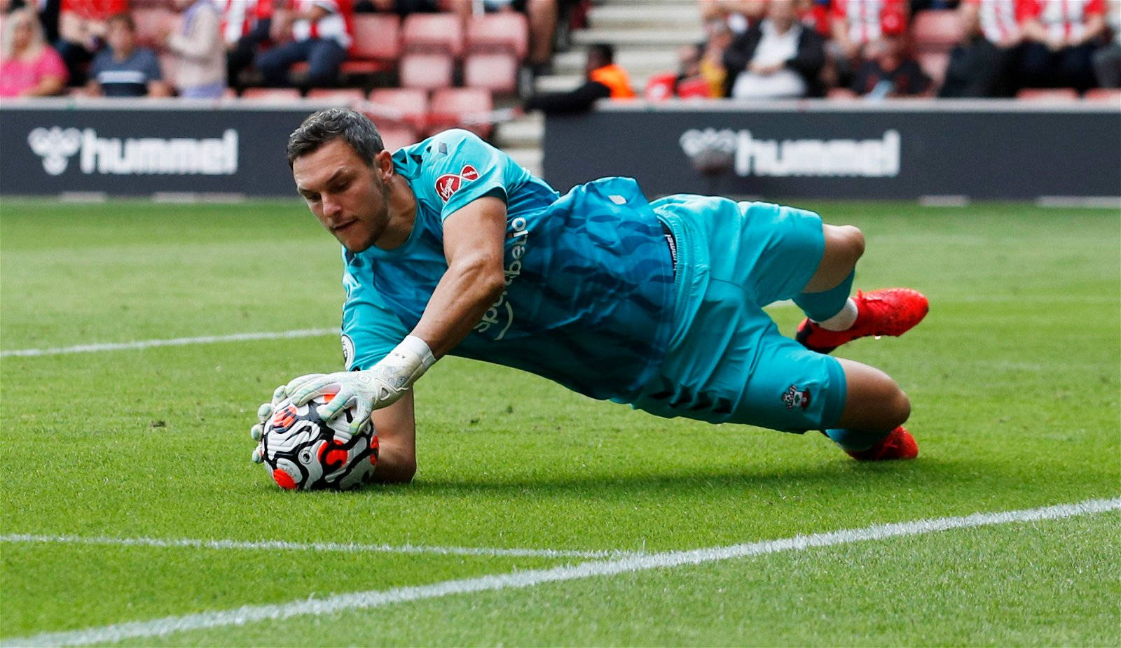 Alex Mccarthy Catches A Soccer Ball Background