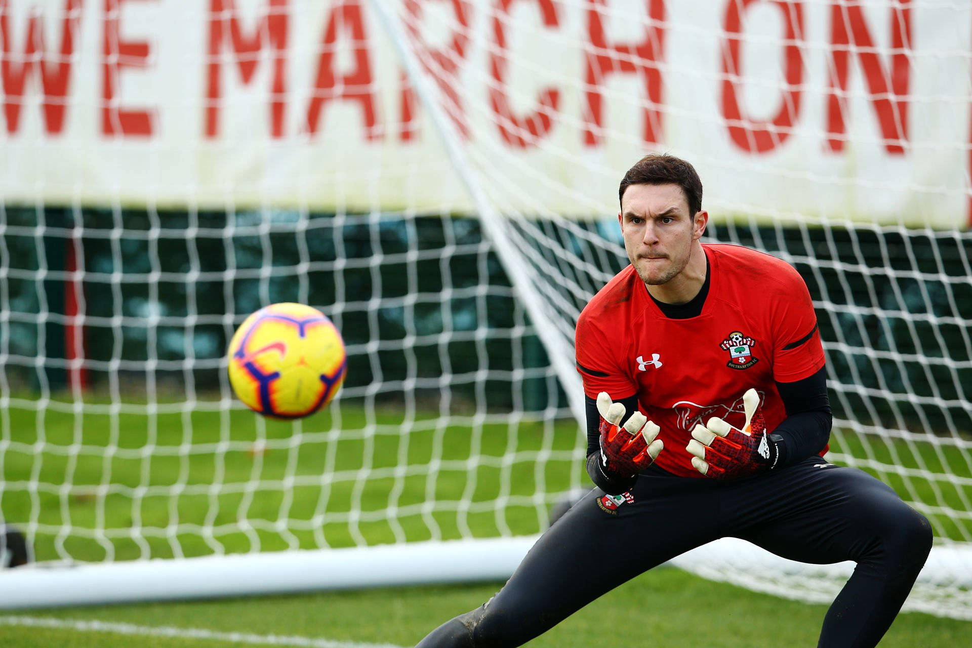 Alex Mccarthy Catching A Ball Background