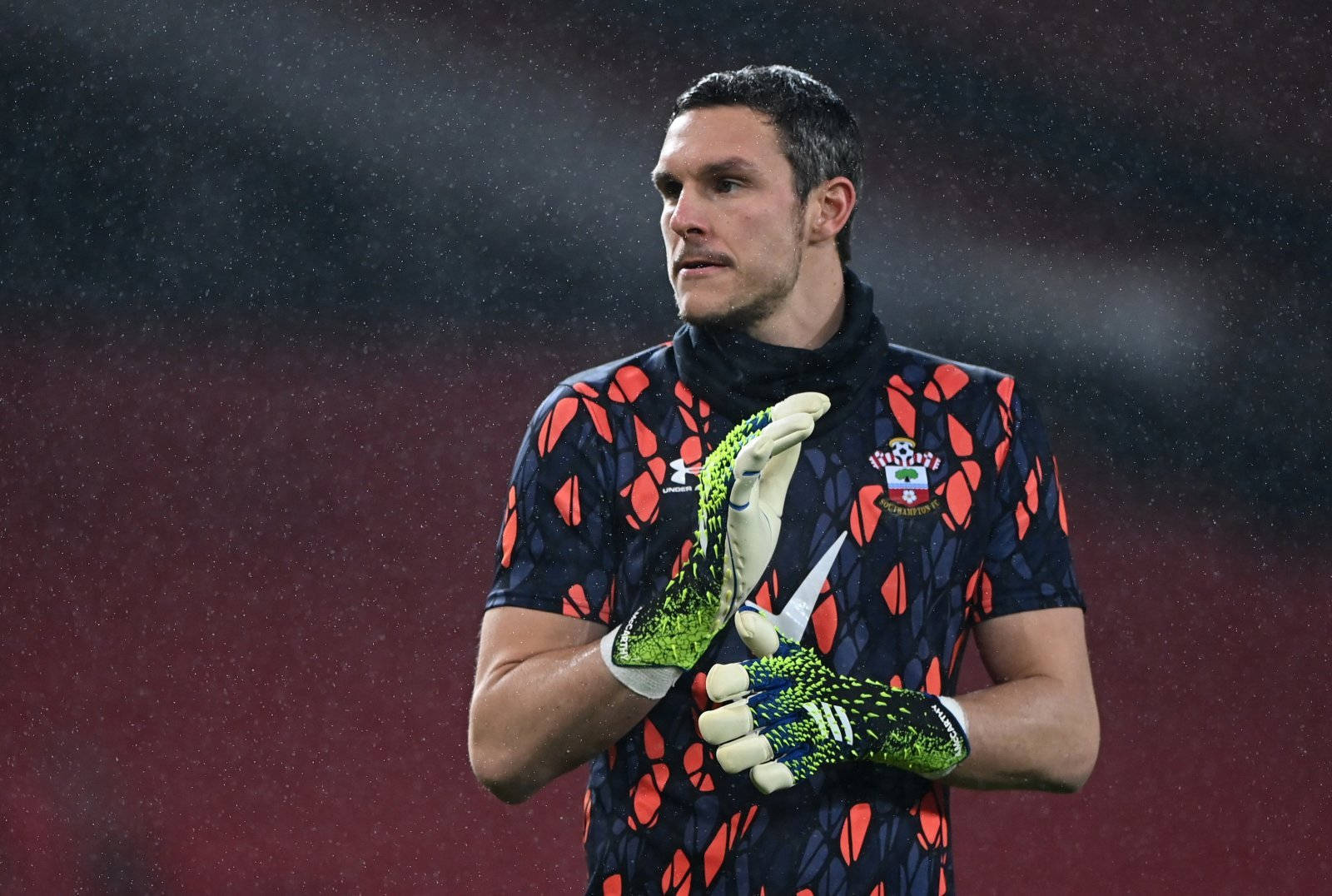 Alex Mccarthy In Black And Orange Jersey Background