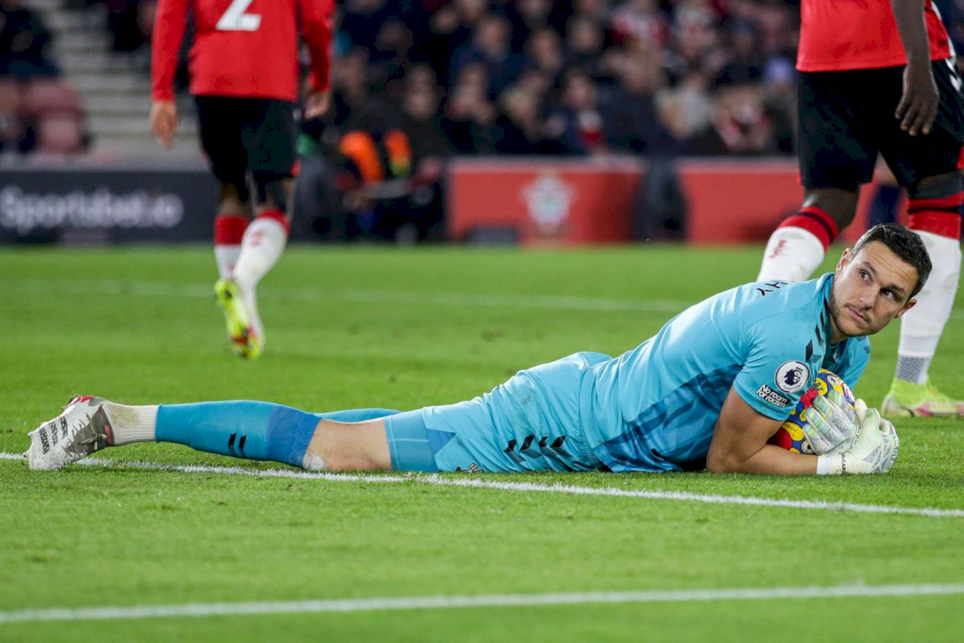 Alex Mccarthy On The Stadium Grass Background