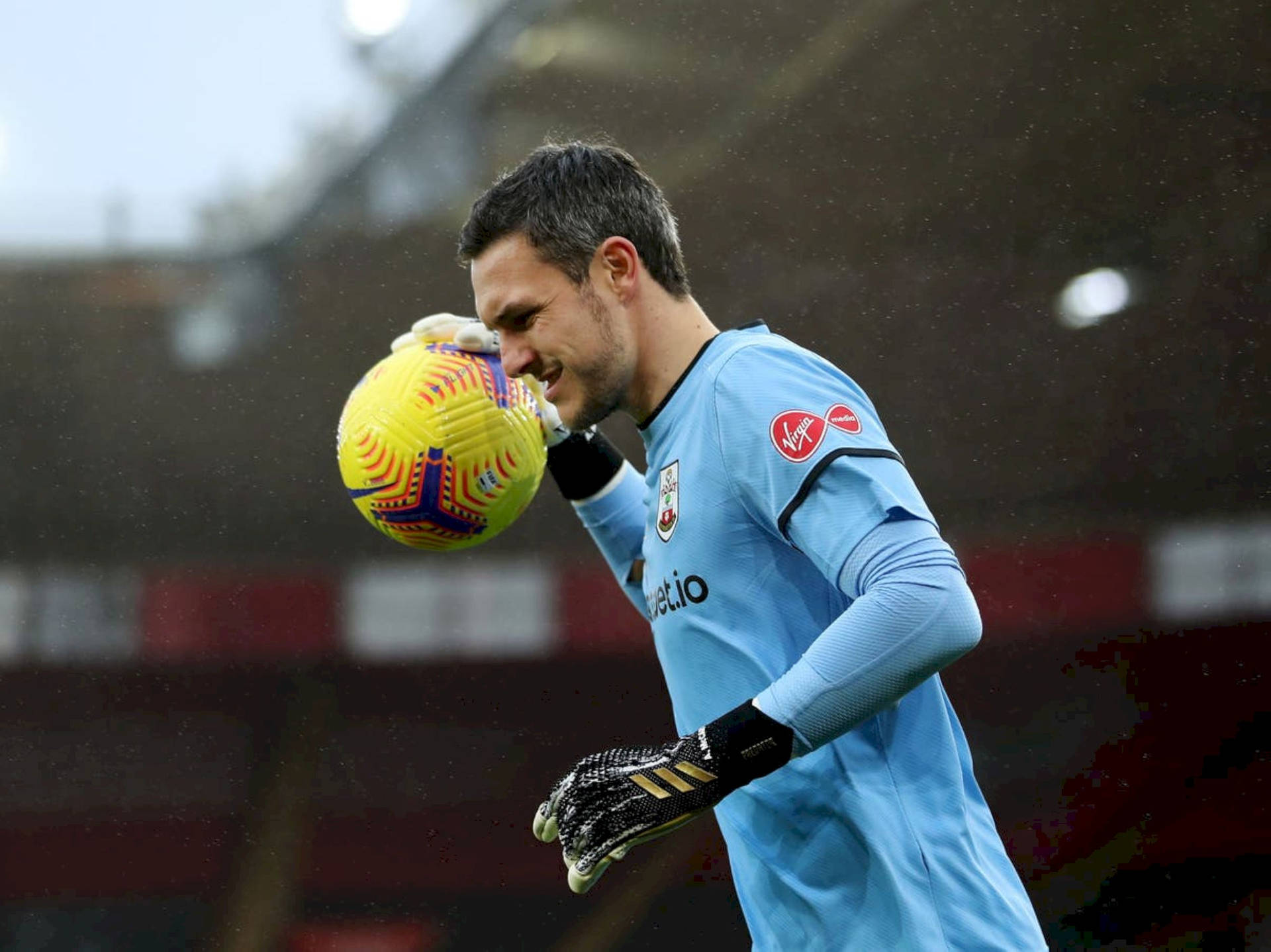 Alex Mccarthy Throws A Soccer Ball Background