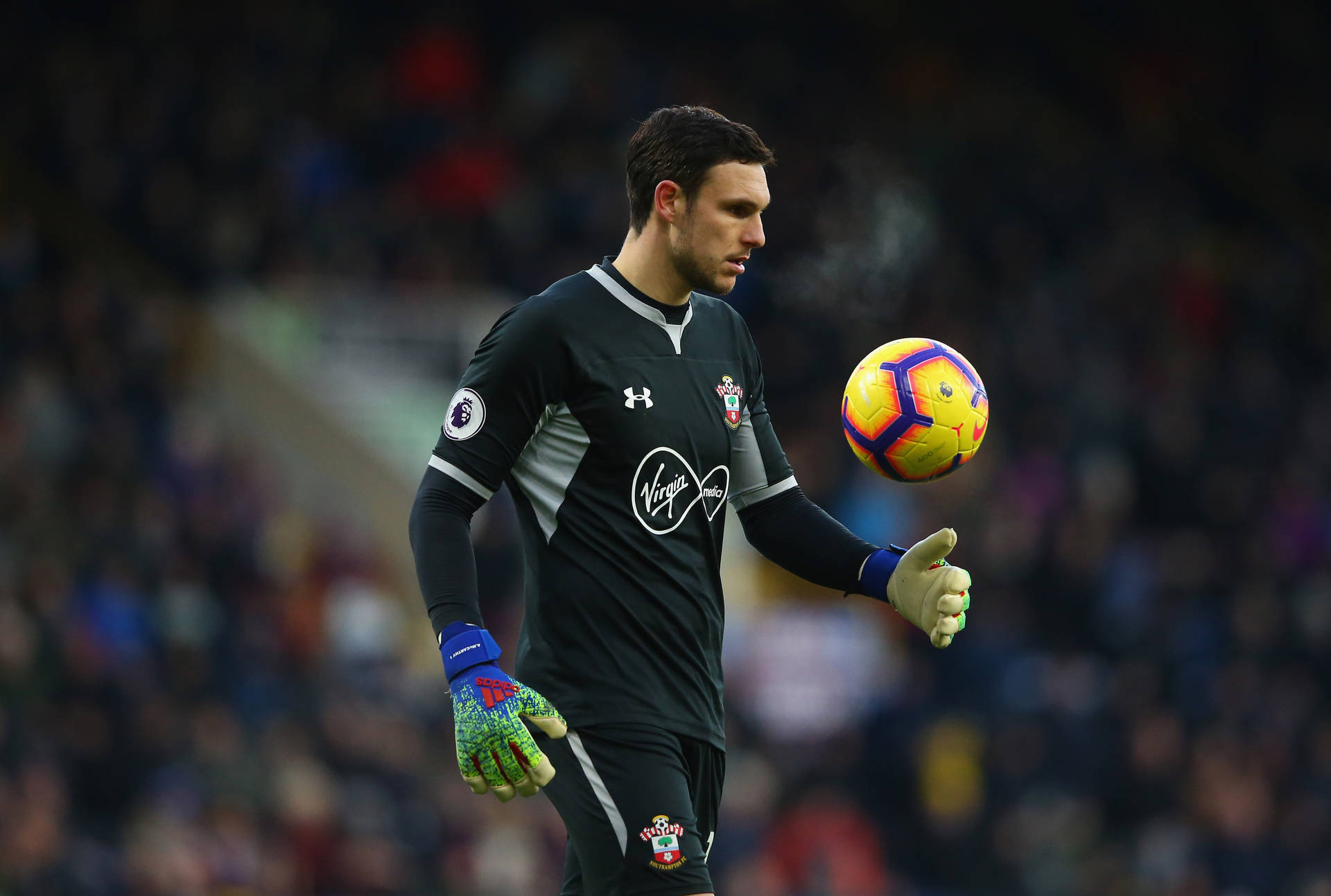 Alex Mccarthy Tossing A Soccer Ball Background