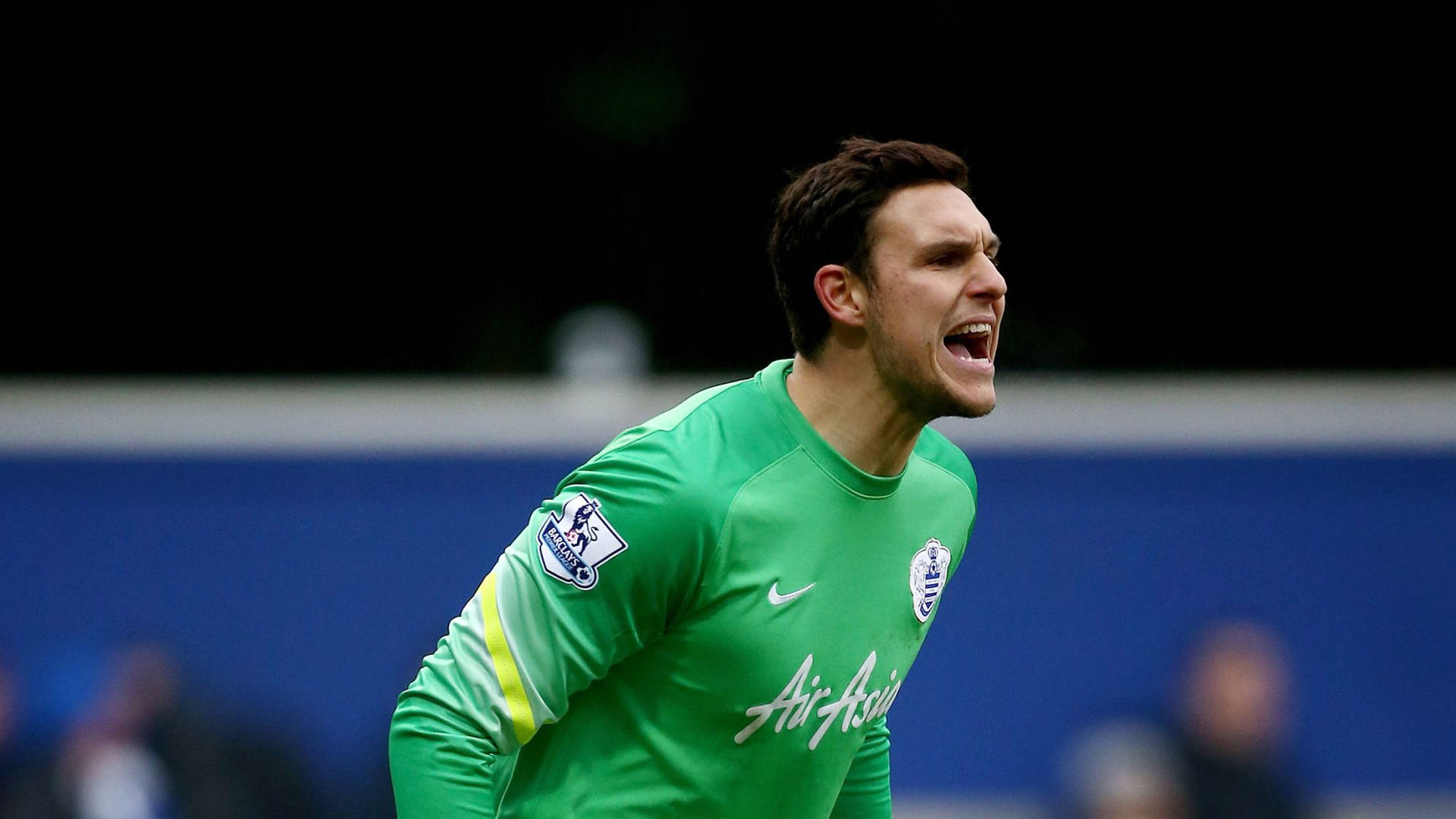 Alex Mccarthy Wearing A Green Jersey Background