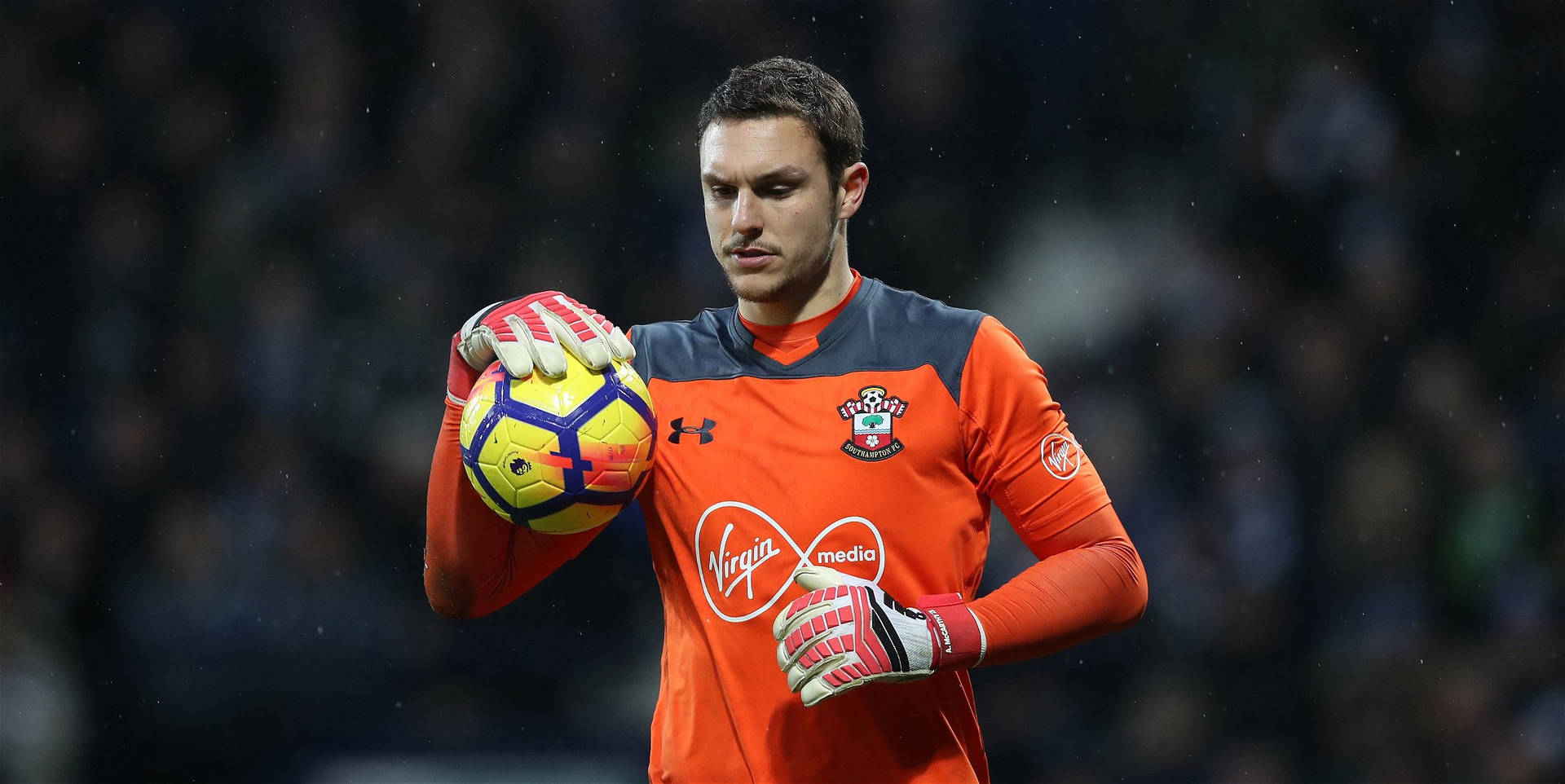 Alex Mccarthy With A Soccer Ball Background