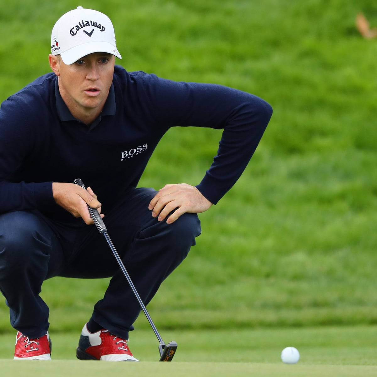 Alex Noren Crouching Down Background