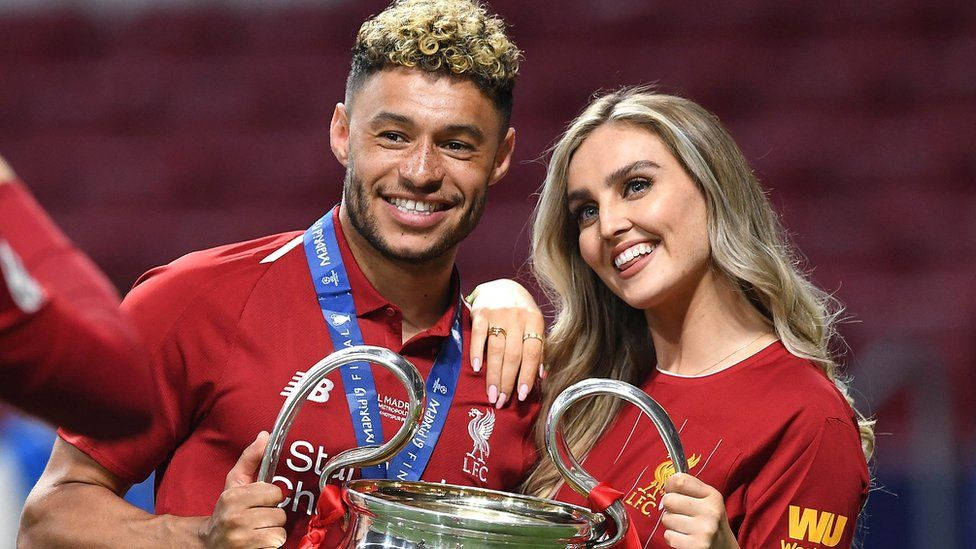 Alex Oxlade-chamberlain And Perrie Edwards Smiling Together Background