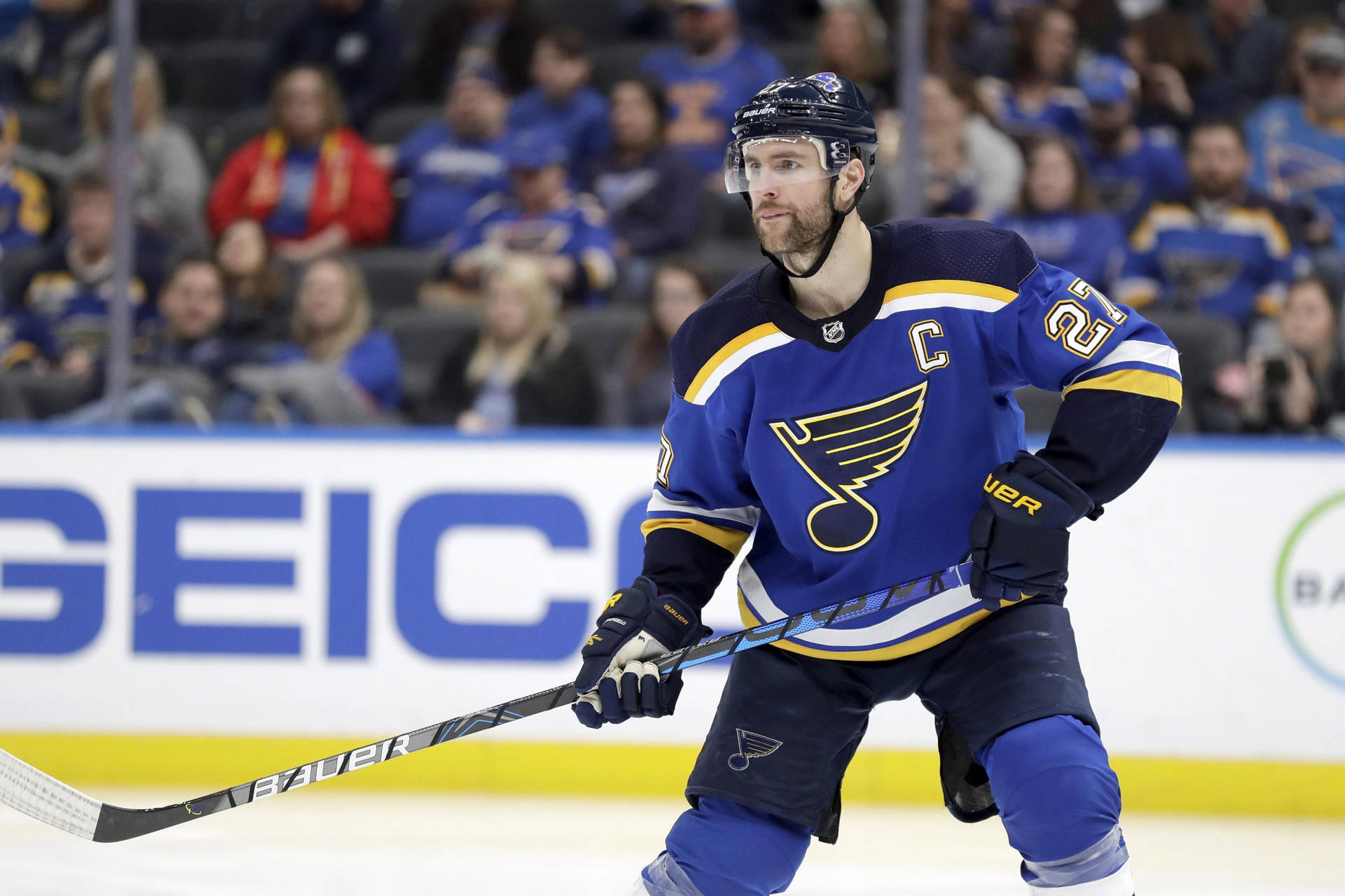 Alex Pietrangelo Poised With Hockey Sticks Background