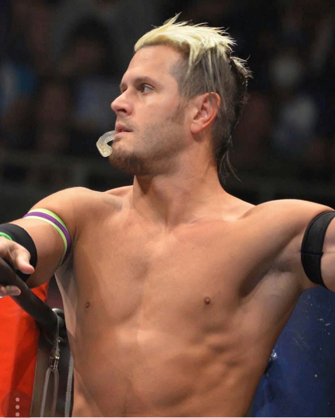 Alex Shelley Biting Mouthpiece Impact Wrestling Background