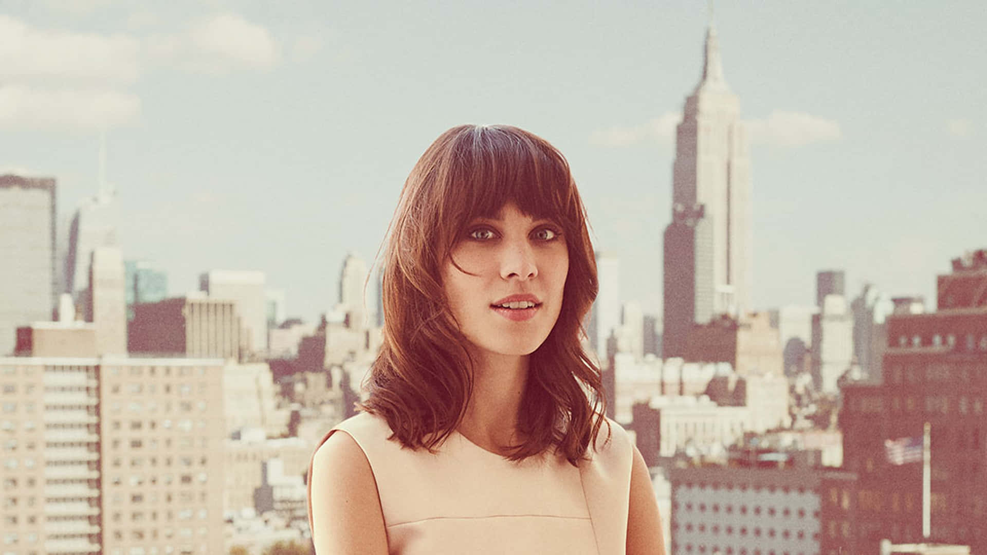 Alexa Chung Radiating Chic Charisma In A Stylish Outfit. Background