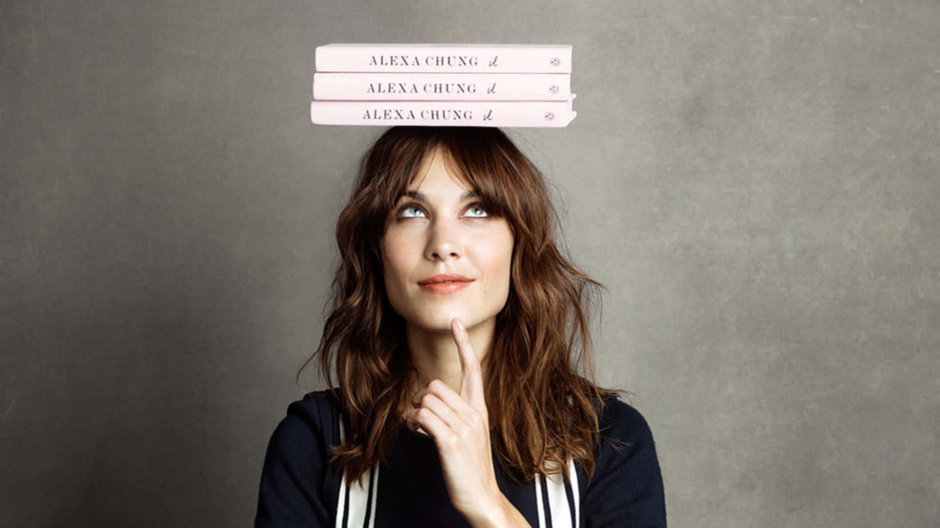 Alexa Chung Thoughtful Pose Background