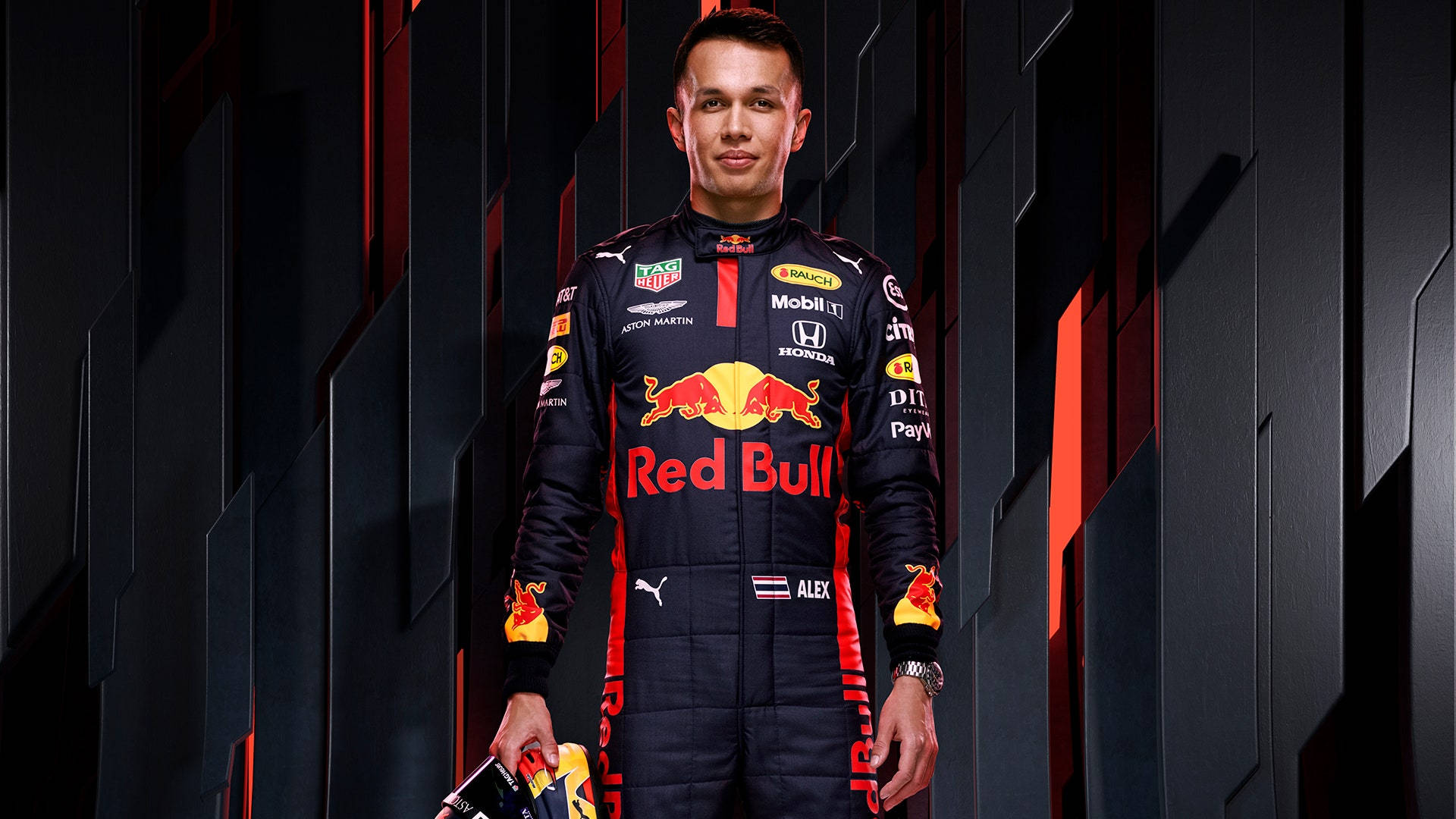 Alexander Albon In His Red Bull Racing Outfit Background