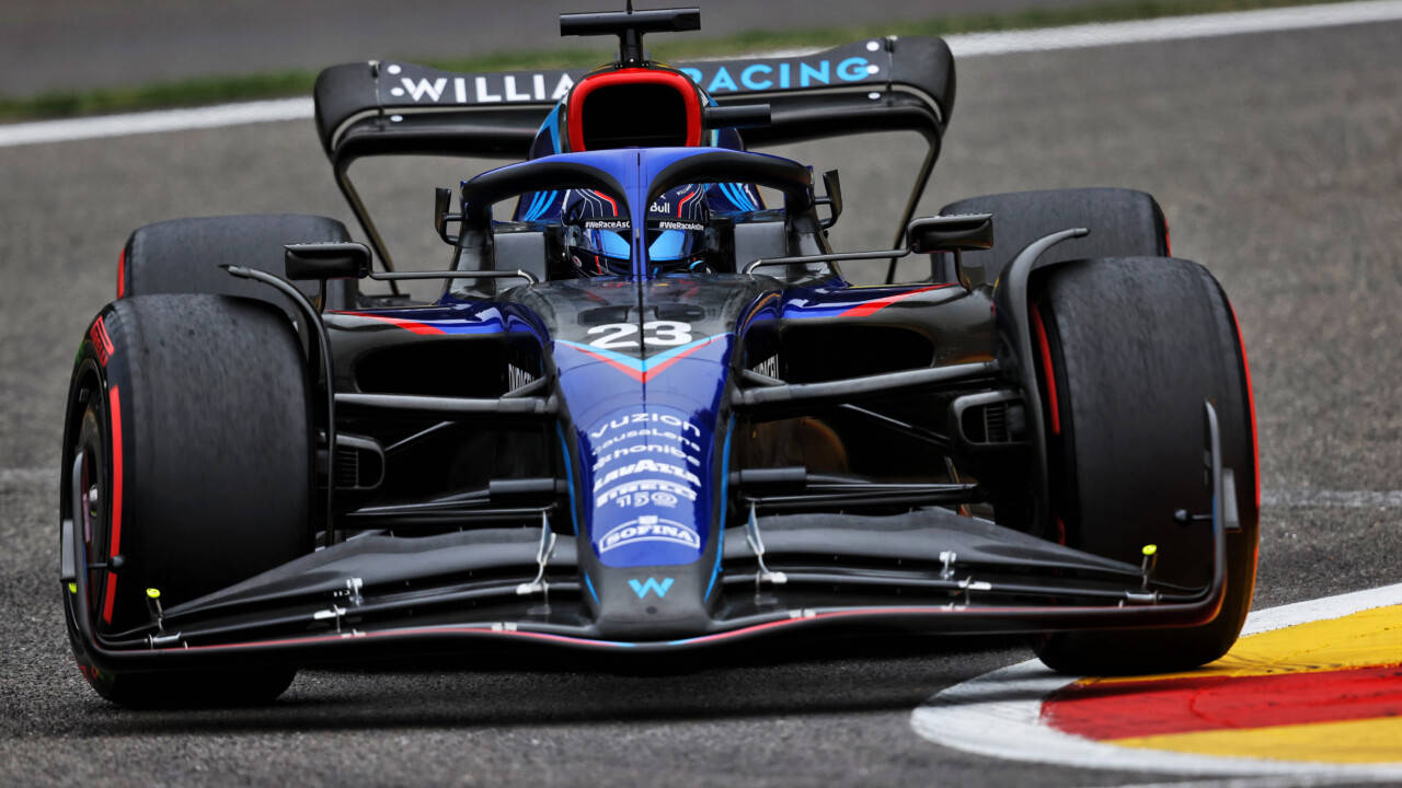 Alexander Albon Inside Blue F1 Car Background