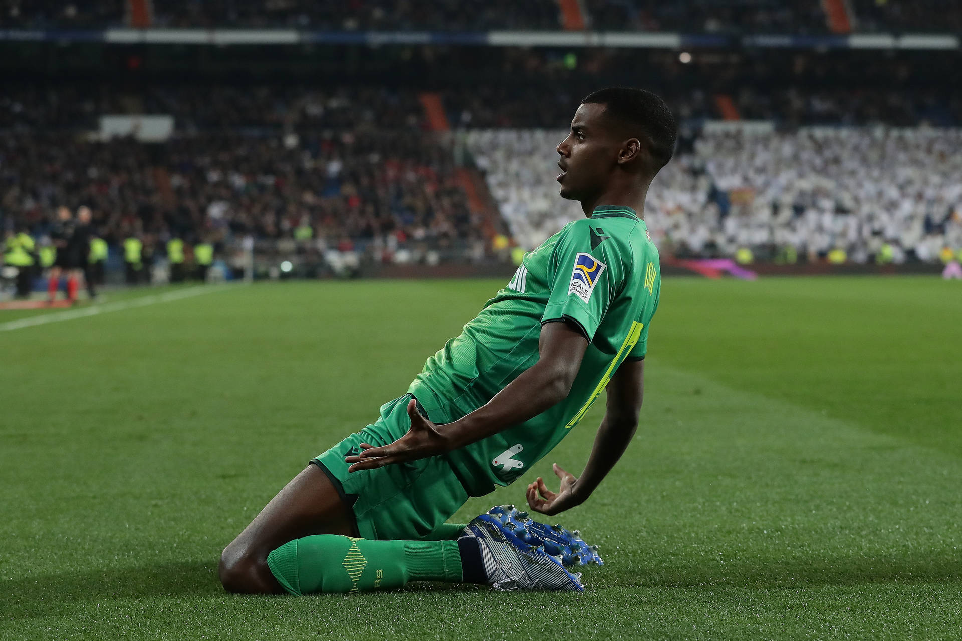 Alexander Isak Kneeling On Grass Background