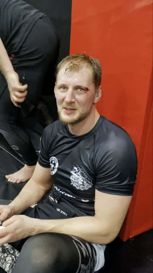 Alexander Volkov Celebrating His Victory Post-match Background