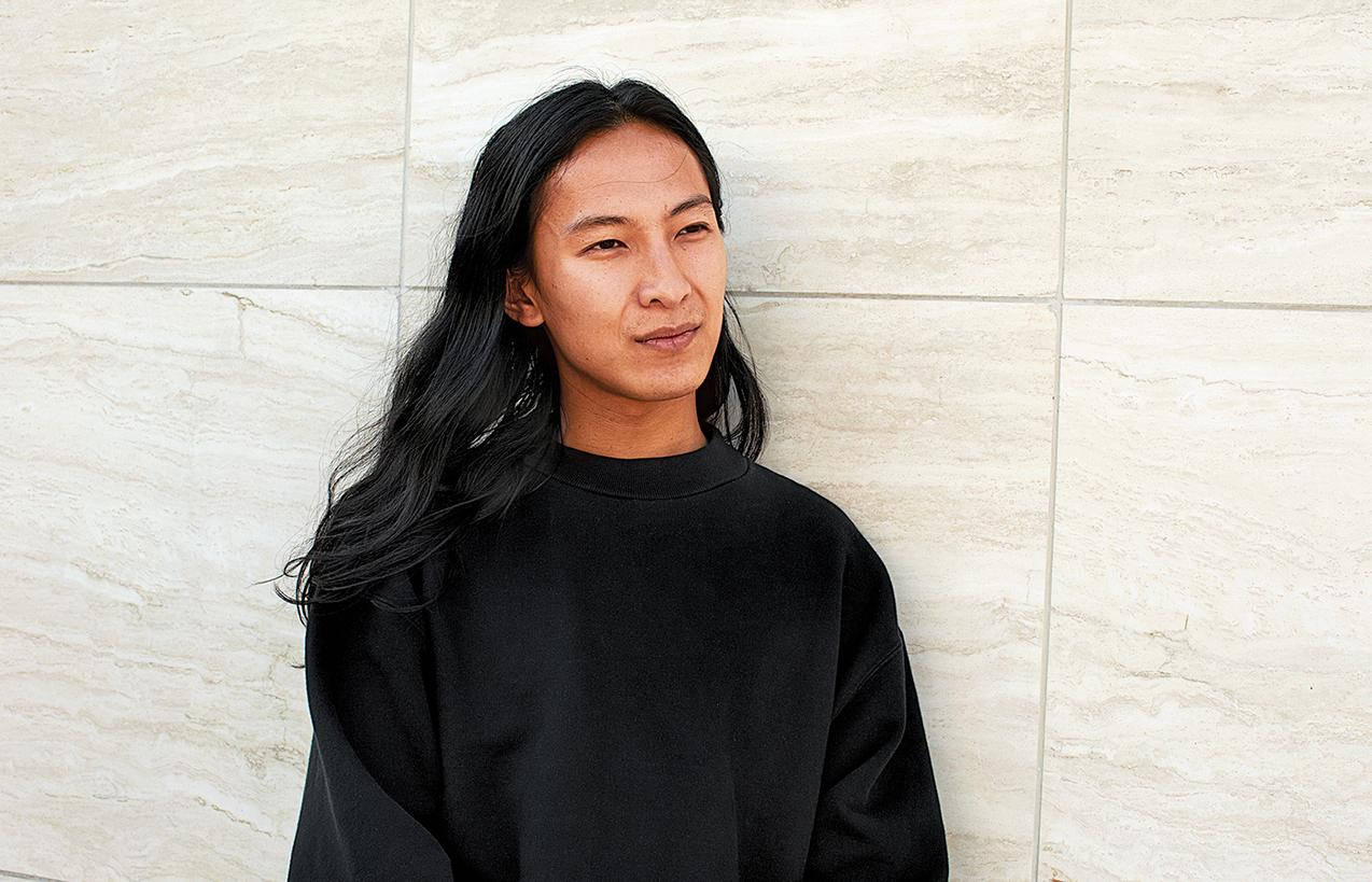 Alexander Wang Leaning Against Wall Background