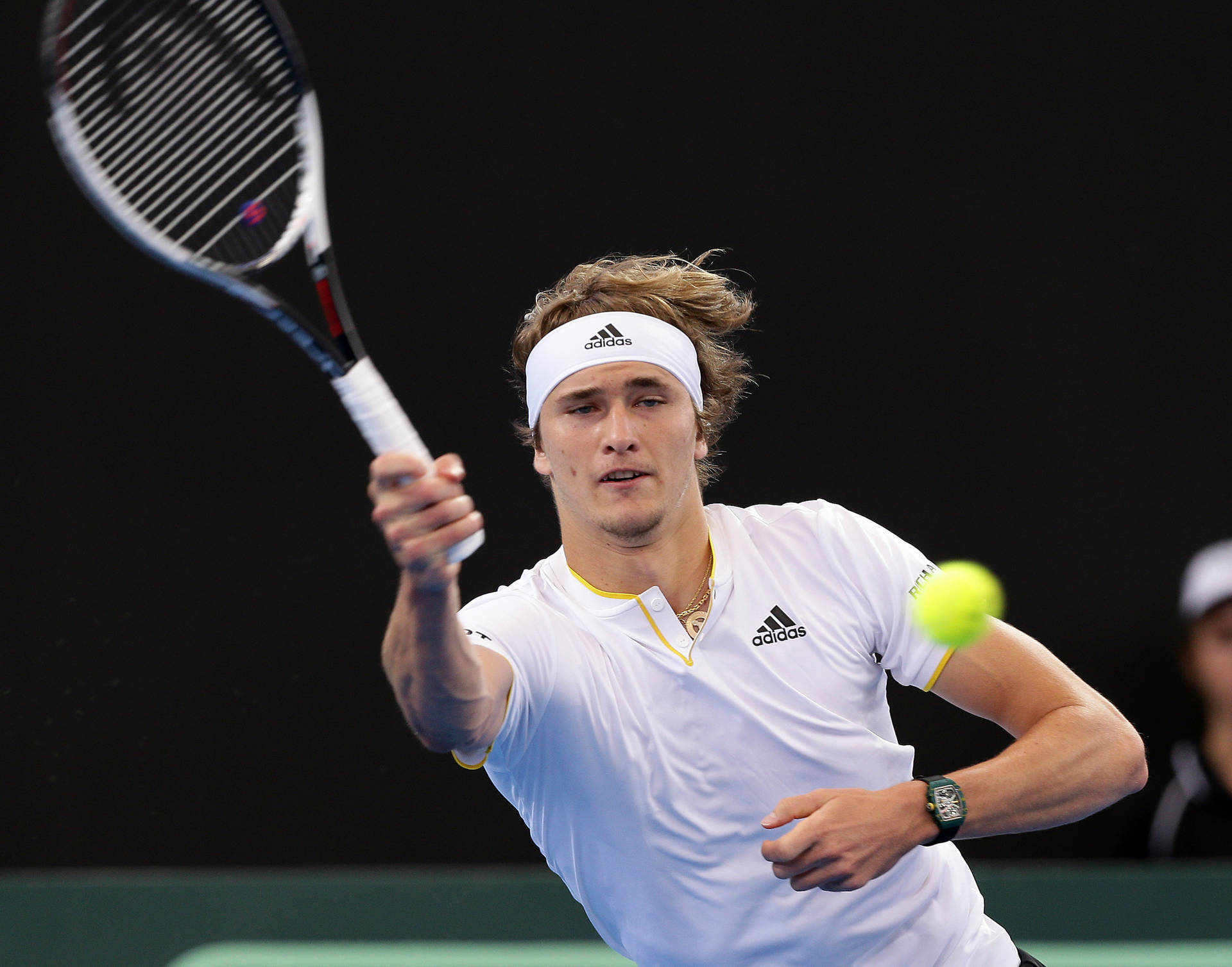 Alexander Zverev Delivers A Forehand Volley On Court Background