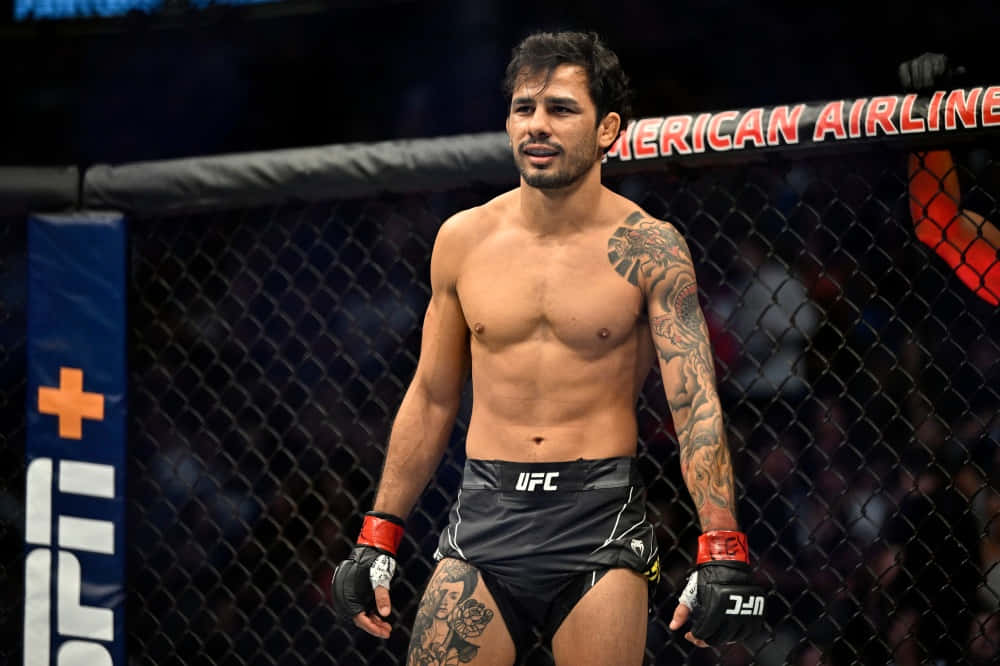 Alexandre Pantoja Standing Inside Ring Background